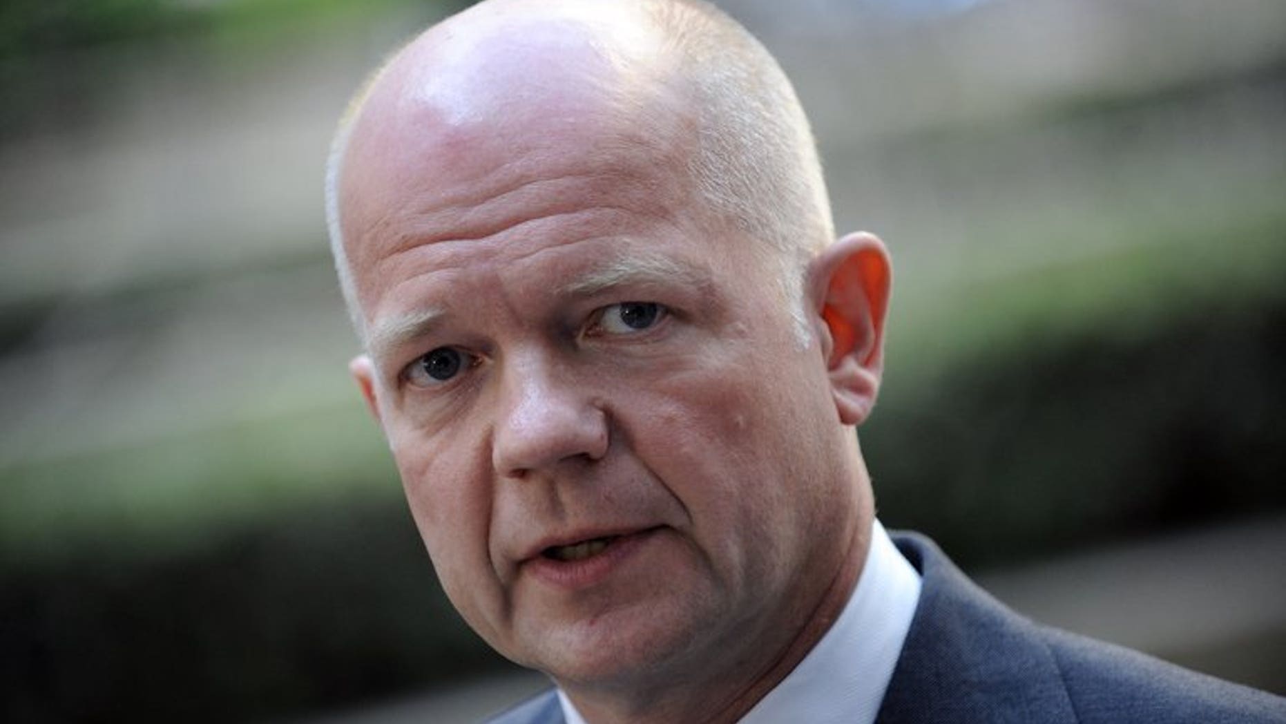 Britain's Foreign Secretary William Hague answers journalists' questions on July 22, 2013 in Brussels. Britain on Saturday expressed 'serious' doubt over the credibility of Zimbabwe's election results, after President Robert Mugabe won a landslide victory among complaints by the opposition of widespread fraud. "We have grave concerns over the conduct of the election," Hague said in a statement.