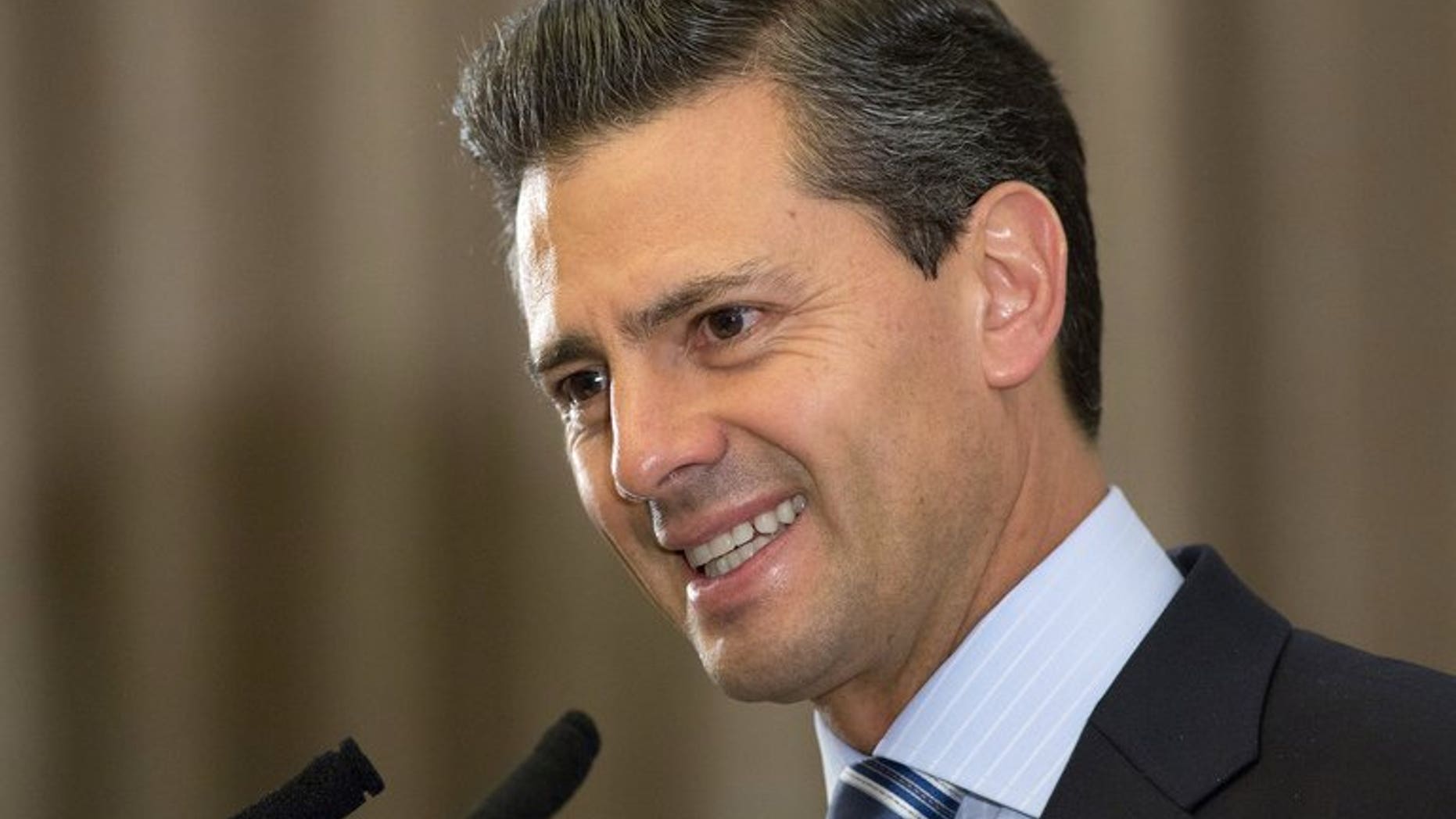 Mexican President Enrique Pena Nieto speaks during a press conference in Central London on June 18, 2013. Nieto left hospital Saturday saying he felt fine after undergoing surgery to remove a thyroid nodule and he hoped to fully return to work next week.