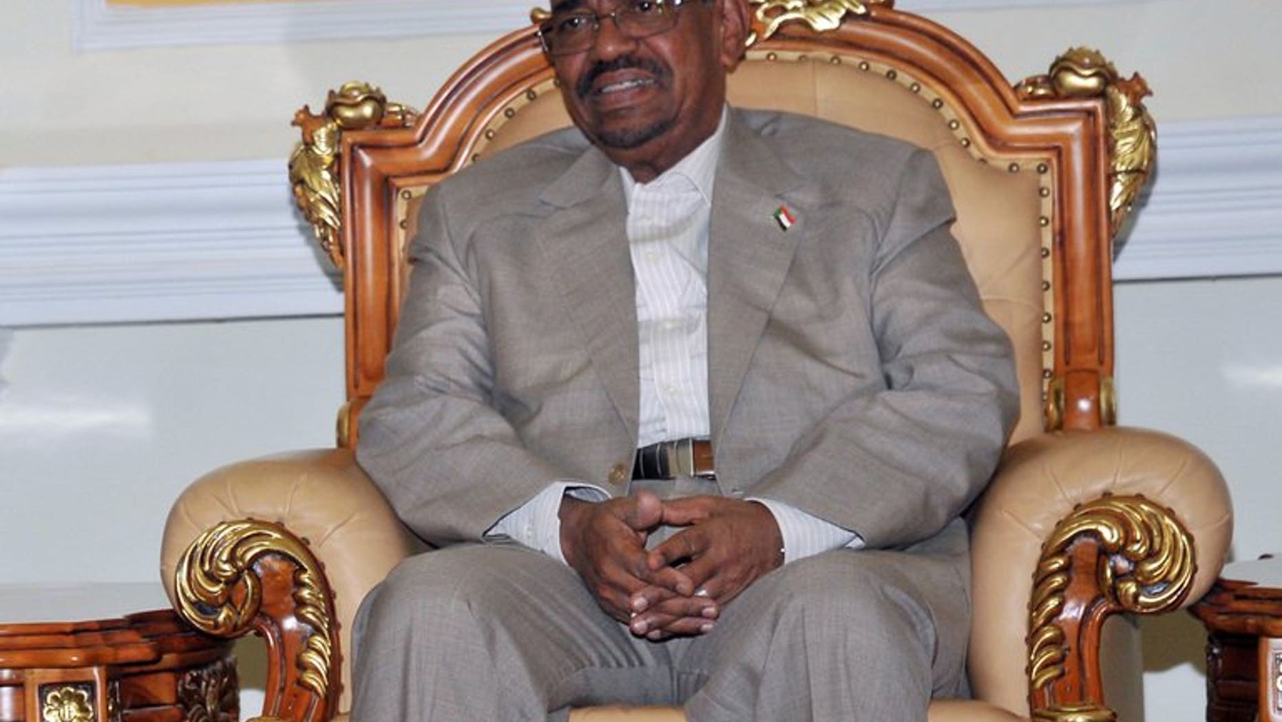 Sudanese President Omar al-Bashir attends a meeting in Khartoum on July 25, 2013. Saudi Arabia denied permission for a plane carrying Sudanese President Omar al-Bashir to travel through its airpace on Sunday for the swearing-in of the new Iranian president, Khartoum said.