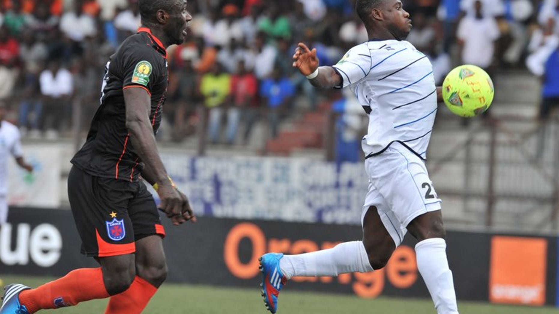 Ivory Coast's Sewe player Kevin Zougoula (right) vies for the ball with Recreativo Libolo of Angola player Edy Nycolas-Boyom during their African Champions league match at the Robert Champroux stadium in Abidjan on August 3, 2013. Zougoula scored a CAF Champions League hat-trick this weekend as Ivory Coast club Sewe San Pedro made a winning Group B debut.
