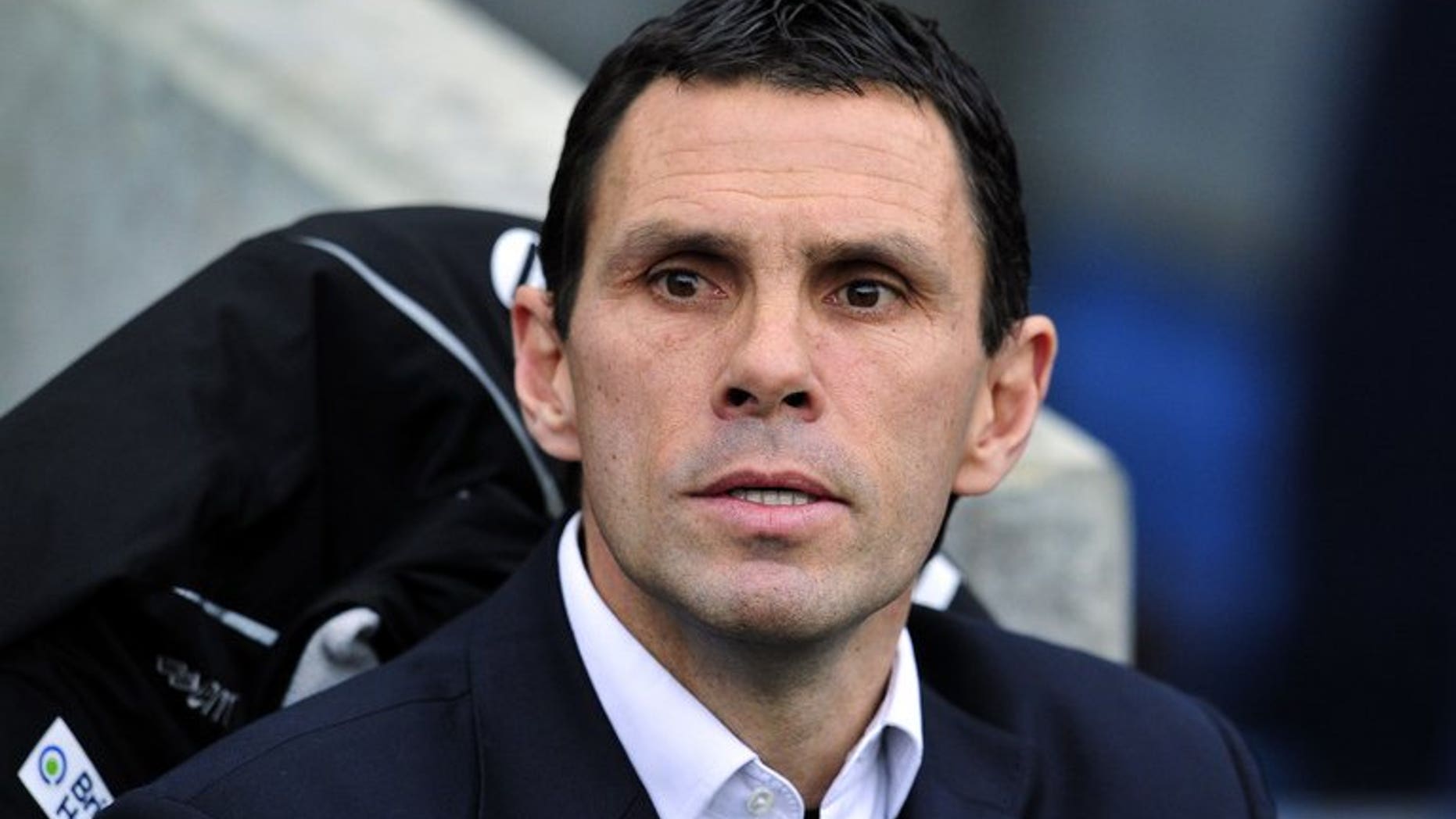 Former Brighton manager Gus Poyet watches a FA Cup match between Brighton & Hove Albion and Arsenal in Brighton on January 26, 2013. Poyet claimed his sacking by the Championship club could go to court.