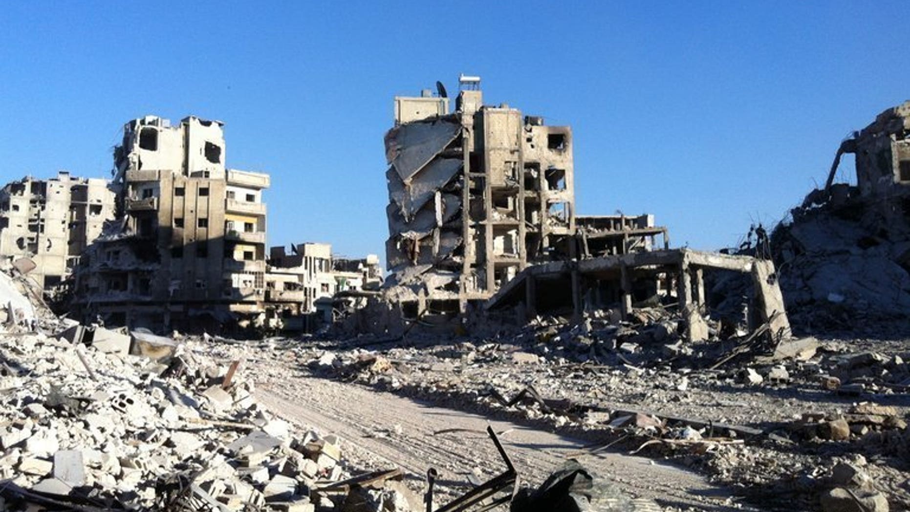 Destroyed buldings are seen in the Khaldiyeh district of Homs, on July 28, 2013. Syrian President Bashar al-Assad, increasingly confident after his forces inflicted two major defeats on rebels in as many months, repeated on Thursday that he was "sure of victory."