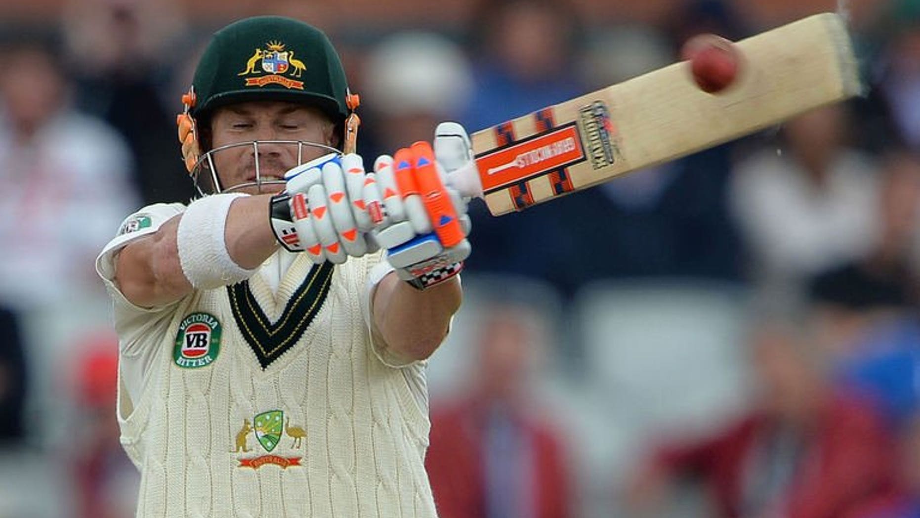 Australia's David Warner plays a shot at Old Trafford in Manchester on August 4, 2013. Warner insists he is relishing the jeers of the Old Trafford crowd that have accompanied his return to Test cricket.