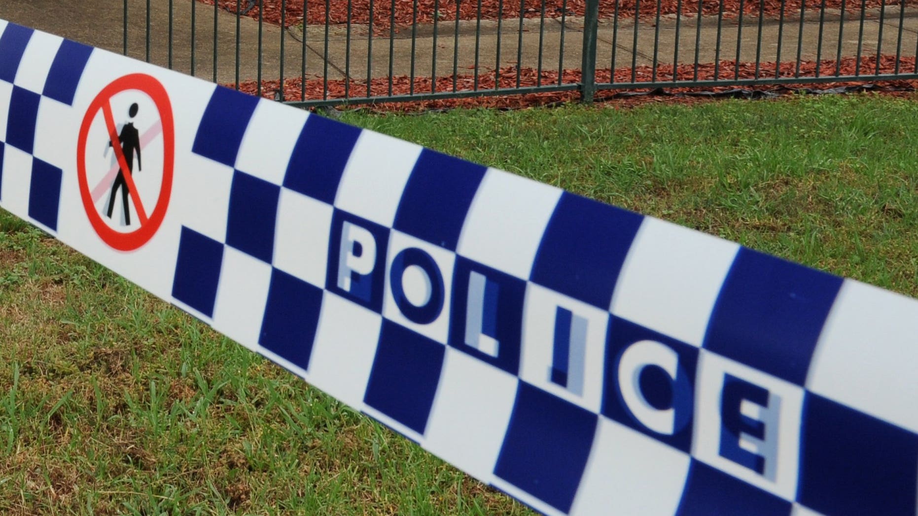This file illustration photo shows a police tape cordoning off a crime scene near Sydney, in 2011. A two-year-old boy was mauled to death at his grandmother's house in a savage attack by a mastiff cross dog, Sunday afternoon at Deniliquin, in southwestern New South Wales.