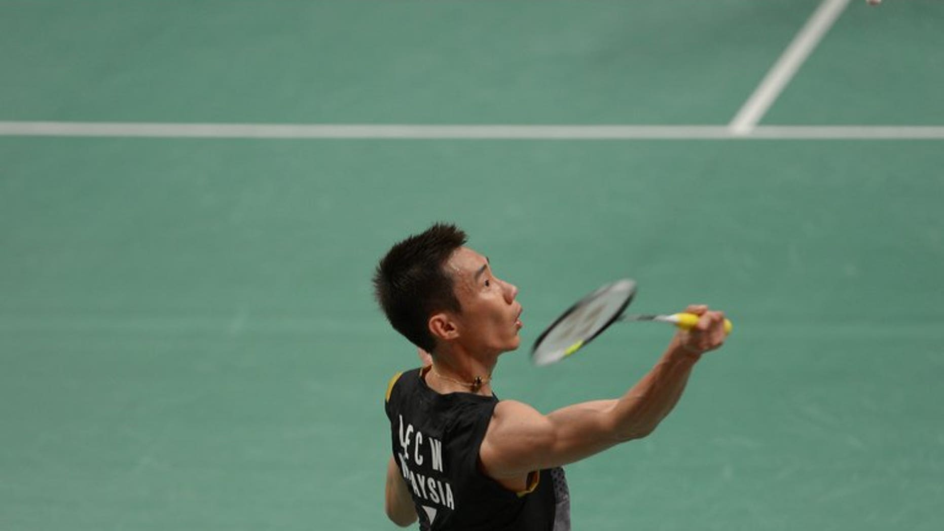 Lee Chong Wei of Malaysia plays a return during the Indonesia Open in Jakarta on June 13, 2013. Lee eased his way through the first round of the BWF World Championships on Monday, taking just 27 minutes to dismiss his opponent.
