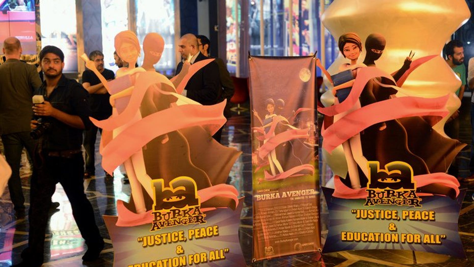 Media gather at the press preview of cartoon show "Burka Avenger" in Rawalpindi, Pakistan on August 4, 2013.
