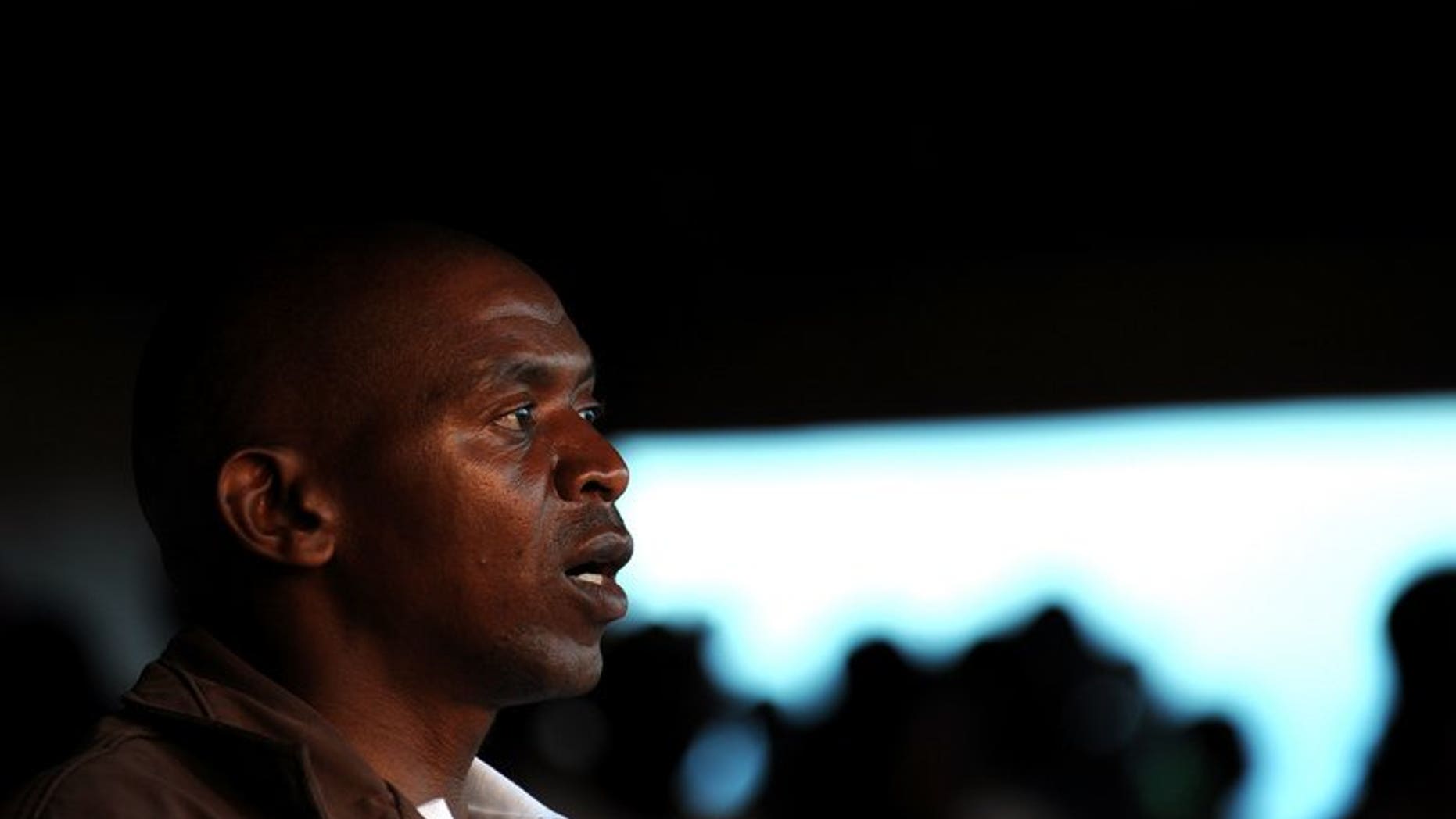 Burundi rebel leader Agathon Rwasa sings his party's anthem during a political rally in the south western town of Nyanza-Lac on May 12, 2010. Rwasa, the historical leader of Burundi's main opposition group, will make his first public appearance in three years and announce his plan to run for president in 2015, his spokesman said.