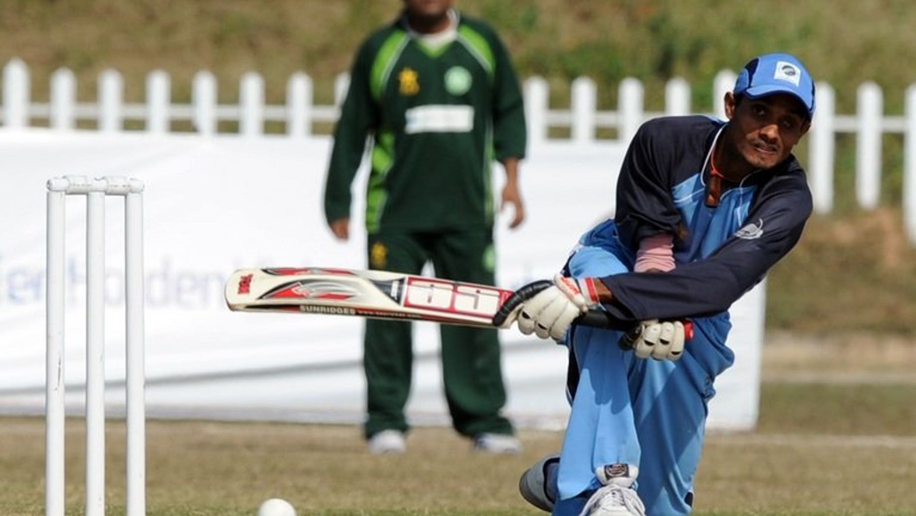 Visually impaired Indian cricketer Ganesh (R) plays a shot during their third and final blind cricket one-day international match between Pakistan and India in Islamabad on November 26, 2011. The body running cricket for the blind in Pakistan said Monday it has persuaded its counterparts in India to come on tour in February next year.