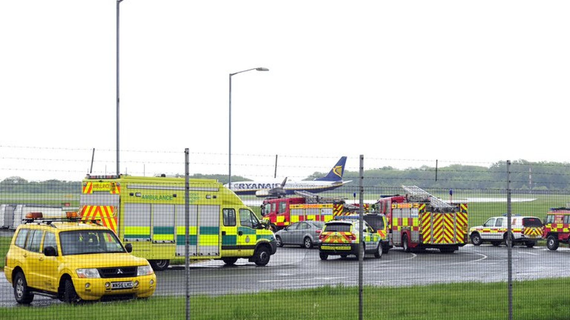 Emergency vehicles are pictured in Stansted Airport on May 24, 2013, shortly after a Pakistani International Airlines (PIA) plane landed. Two men accused of endangering a Pakistan International Airways plane denied the charges in an English court on Monday.