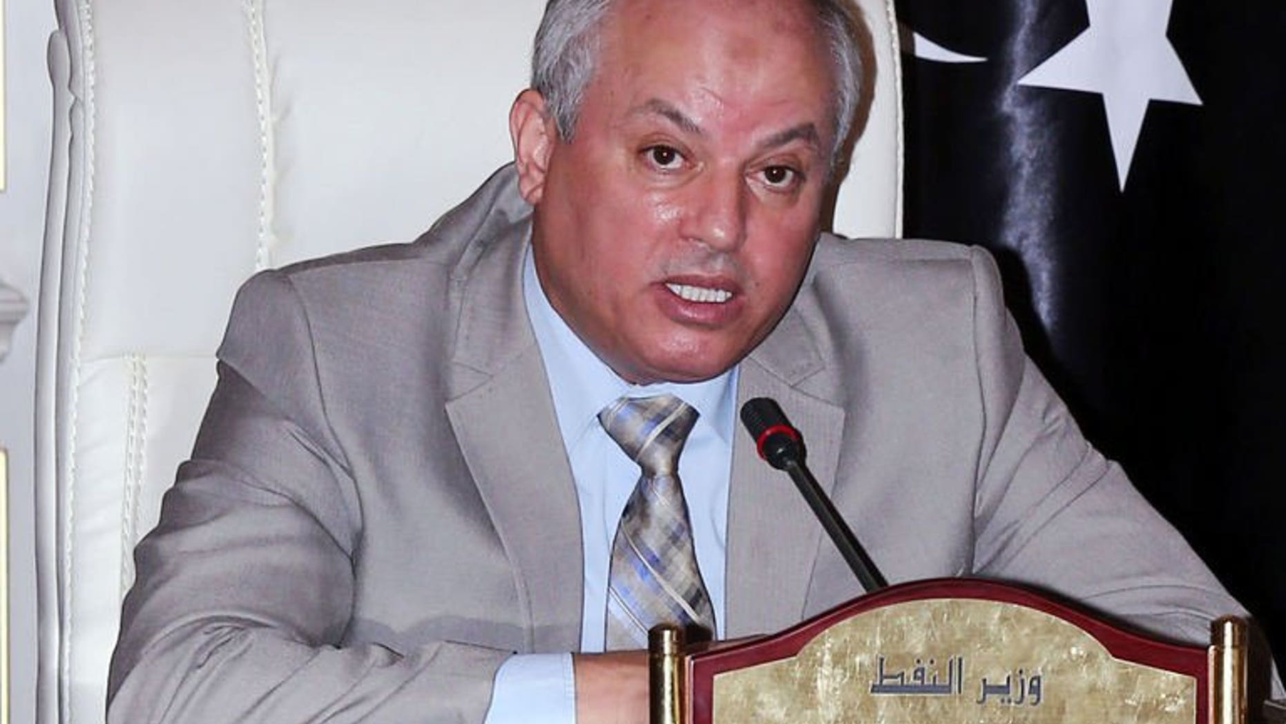 Libya's Minister of Oil and Gas Abdelbari al-Aroussi speaks during a press conference on August 5, 2013 in Tripoli. Aroussi said Libya's oil production have come back to normal after protesters forced the closure of exploration terminals.