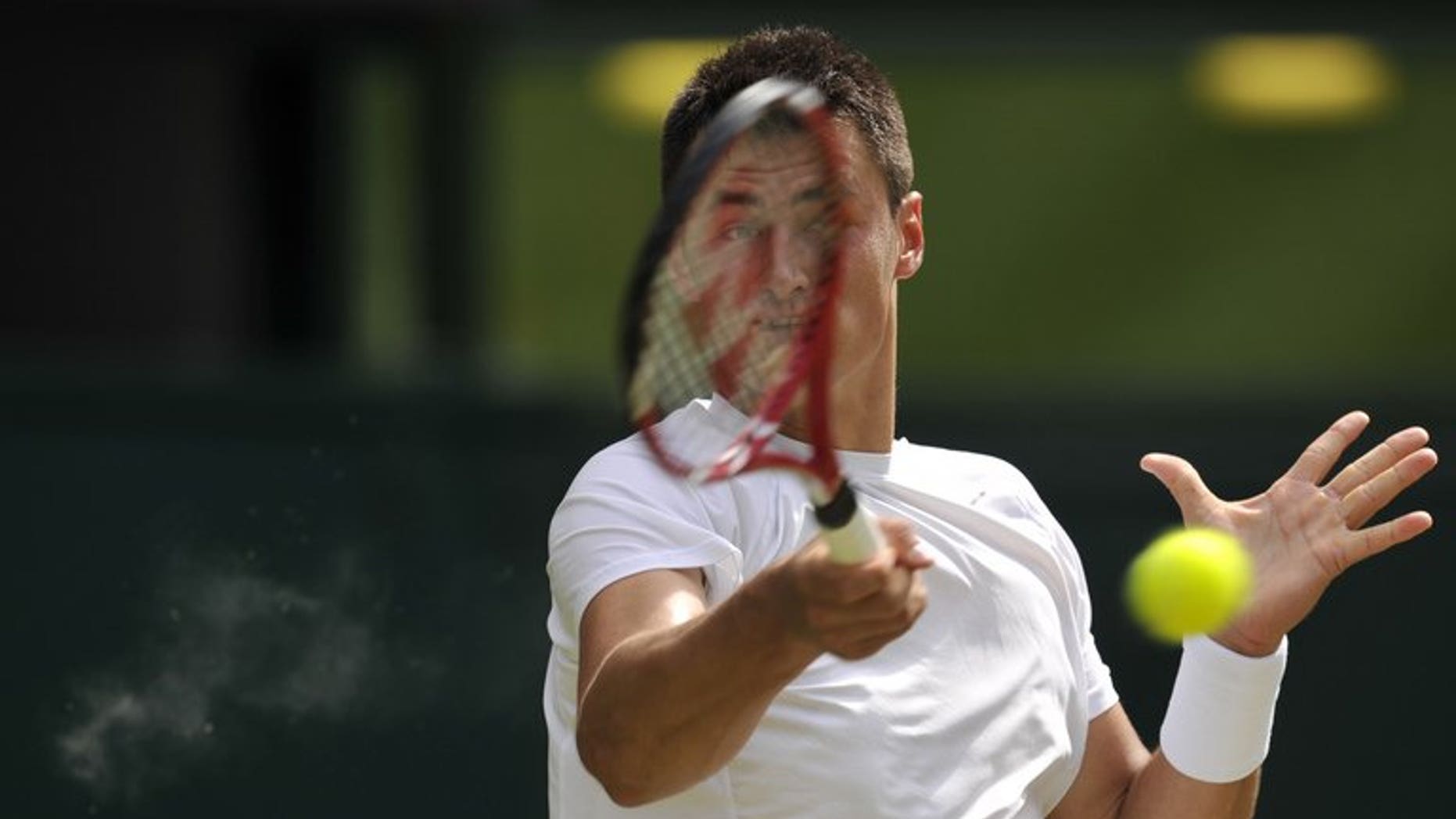 Australia's Bernard Tomic returns at the All England Club in Wimbledon, southwest London, on June 29, 2013. German Florian Mayer defeated Tomic 5-7, 6-3, 6-3 on Monday, ending the Australian's chances of playing top seed Novak Djokovic at the Montreal Masters.