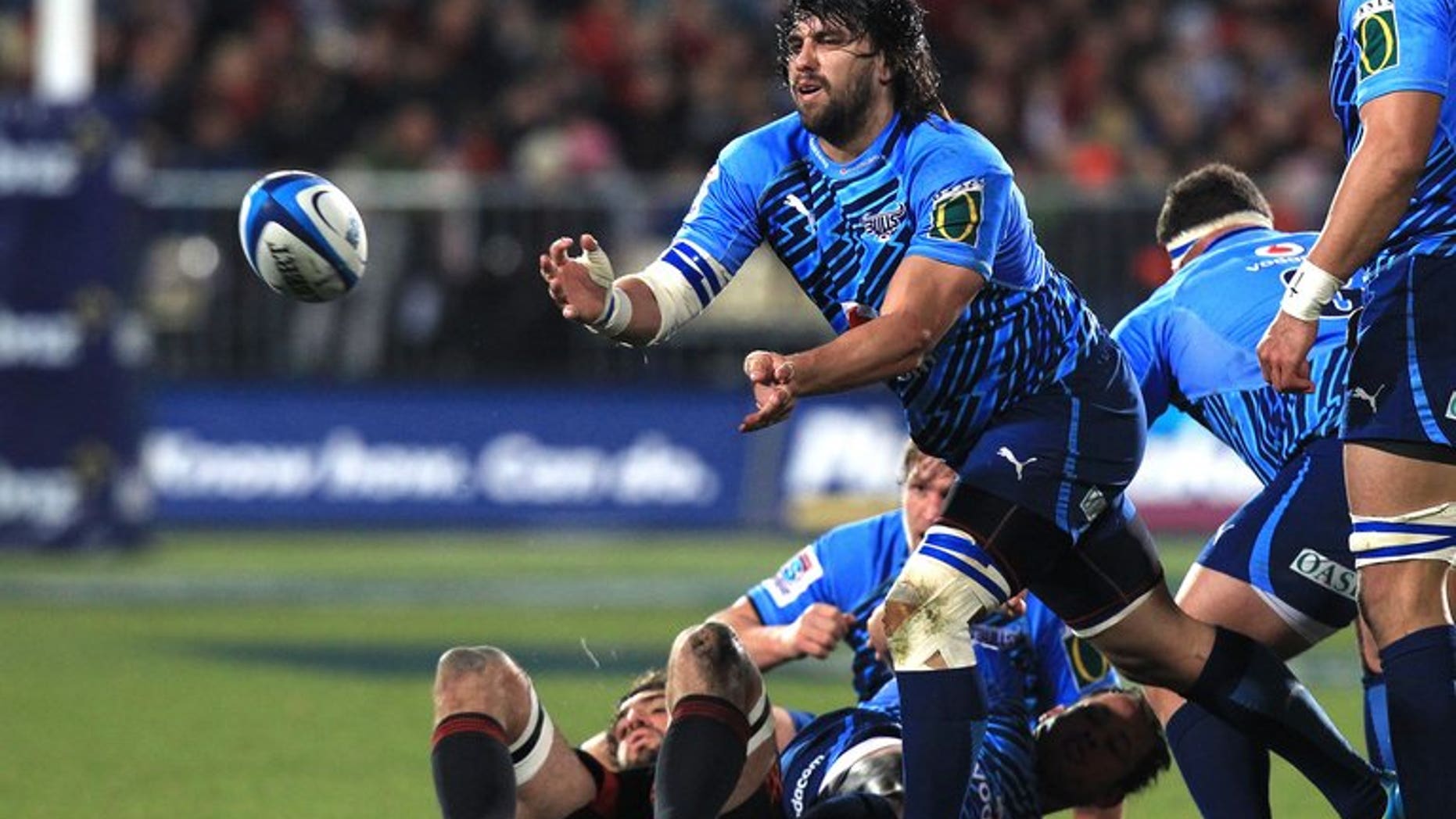 This file photo shows Jacques Potgieter making a pass during a Super 15 rugby union match in Christchurch, in 2012. The New South Wales Waratahs have pulled off a coup by announcing on Tuesday the signing of Potgieter on a two-year contract. The 27-year-old Springbok prop, is known for his physicality.