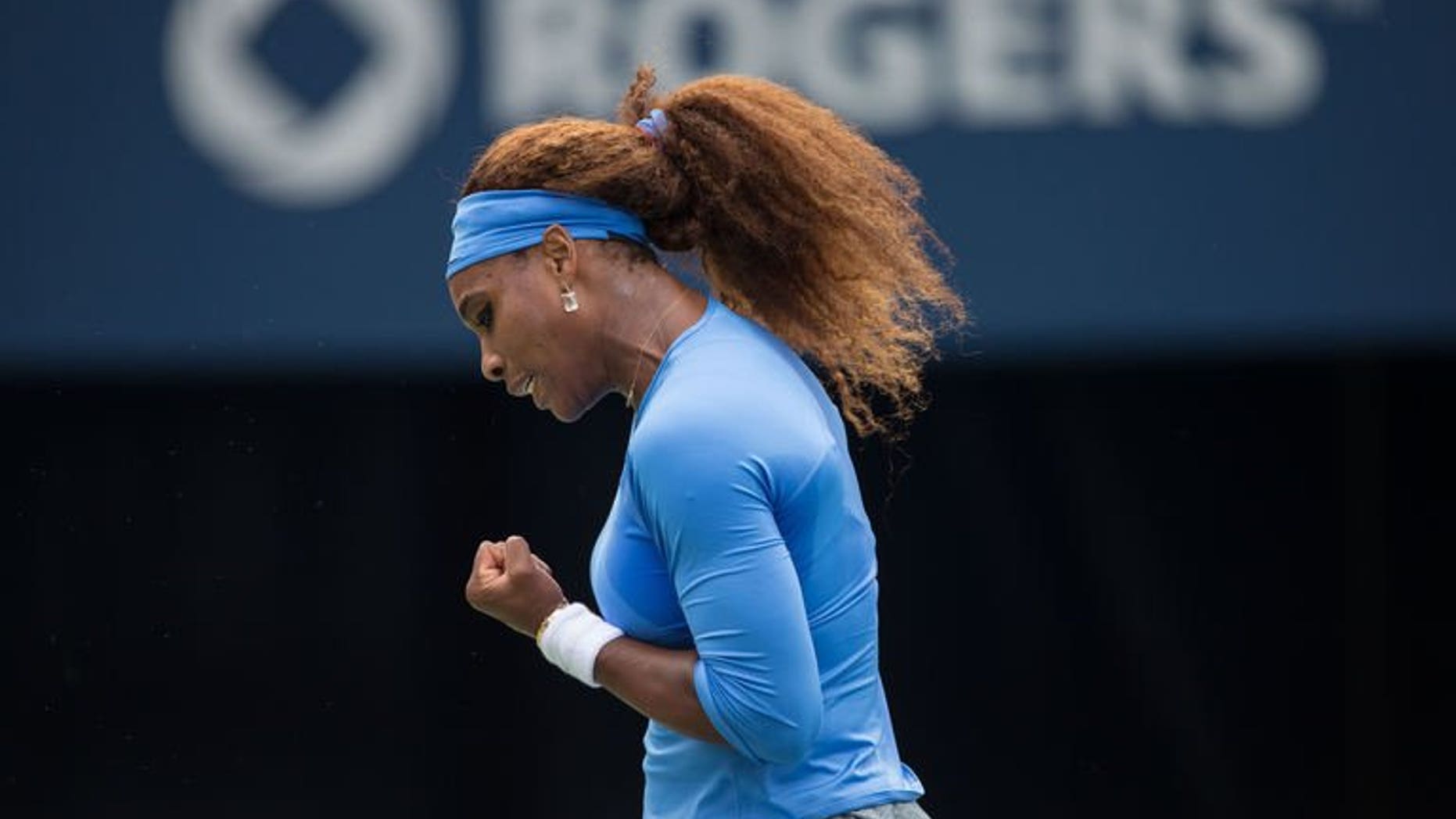 Serena Williams of the United States celebrates a point during the final of the Rogers Cup against Sorana Cirstea of Romania at Rexall Centre at York University in Toronto, Ontario, Canada on August 11, 2013. Serena steamrolled Cirstea 6-2, 6-0 on Sunday to win the WTA title in Toronto and signal her readiness for a US Open title bid.