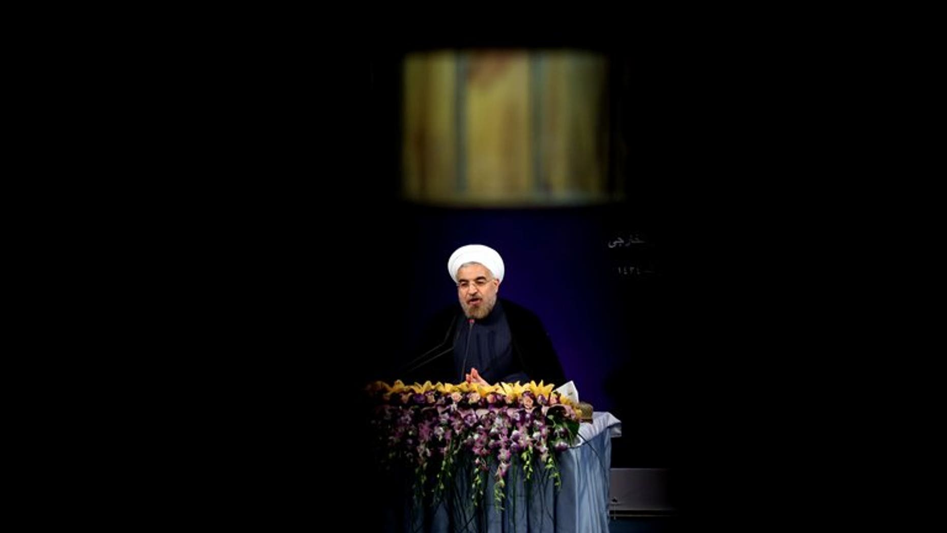 Iran's President Hassan Rowhani adresses his first news conference after taking office, in Tehran on August 6, 2013. Iran's parliament began debating on Monday the 18-member cabinet proposed by President Hassan Rowhani ahead of a vote of confidence later in the week.