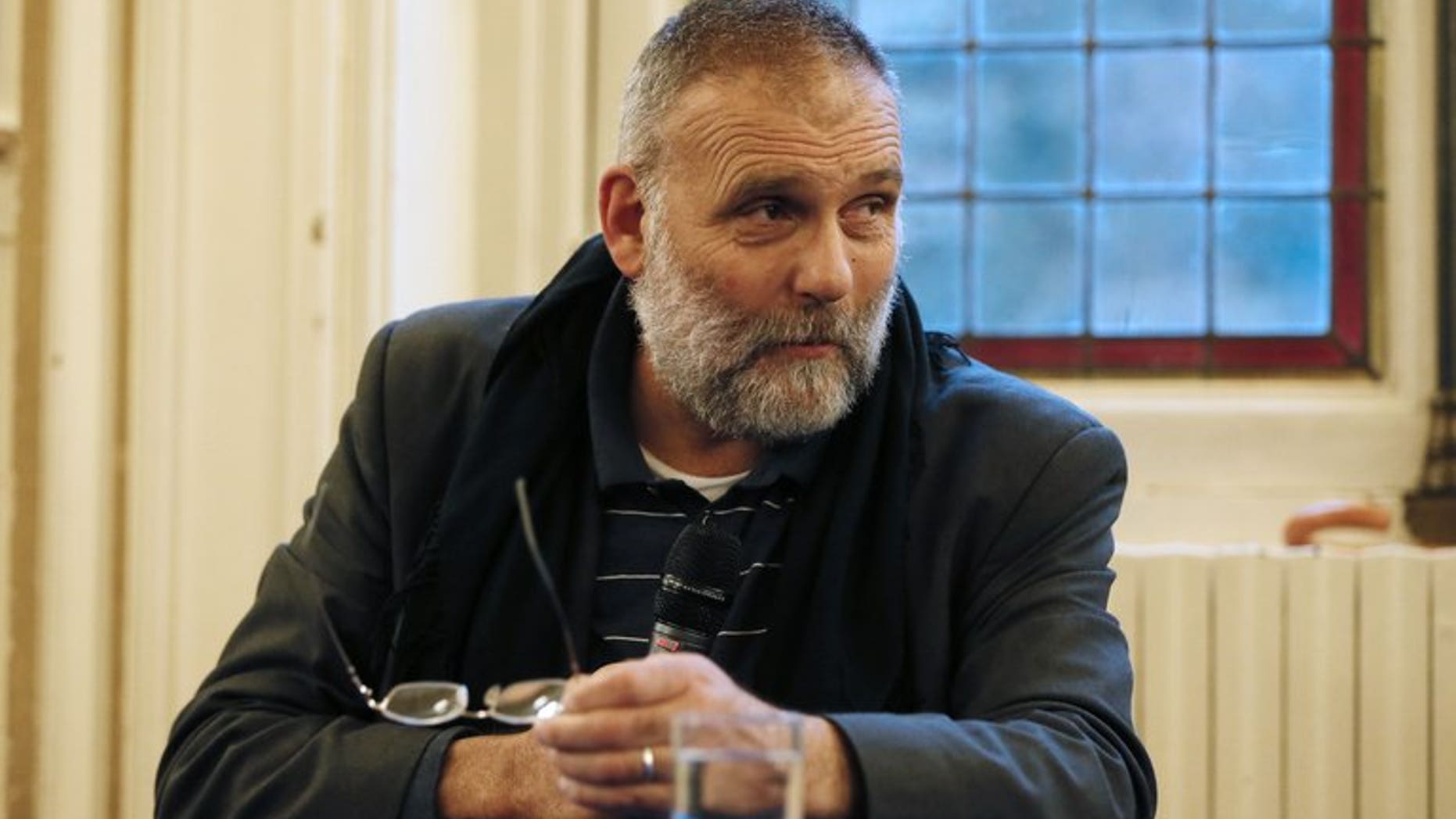 Italian priest Paolo DallâOglio takes part in a conference on Syrian Christians on September 25, 2012 in Paris. Protesters have held daily demonstrations against jihadists in the northern Syrian city of Raqa, demanding the release of "hundreds" of missing people including an Italian Jesuit priest, a watchdog said on Monday.