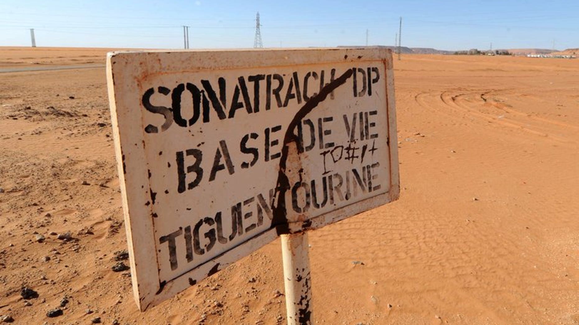 A road sign near a compound belonging to Algeria's Sonatrach oil company in the deep south desert on January 19, 2013. International arrest warrants have been issued for former energy minister Chekib Khelil and eight others in connection with a corruption case at energy firm Sonatrach, Algeria's prosecutor general said Monday.