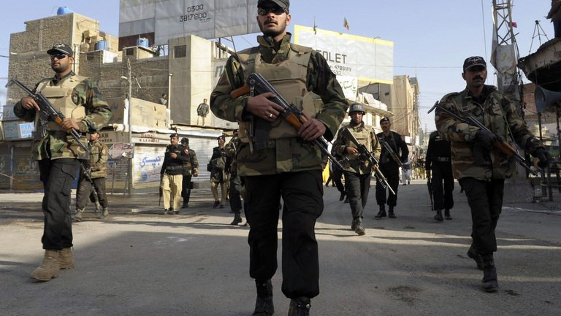 Pakistani police commandos patrol during a Shiite Muslim Ashura procession in Quetta on December 6, 2011. A bomb planted on a bicycle killed at least two people and wounded another in the restive province of Baluchistan in southwest Pakistan on Monday, officials said.