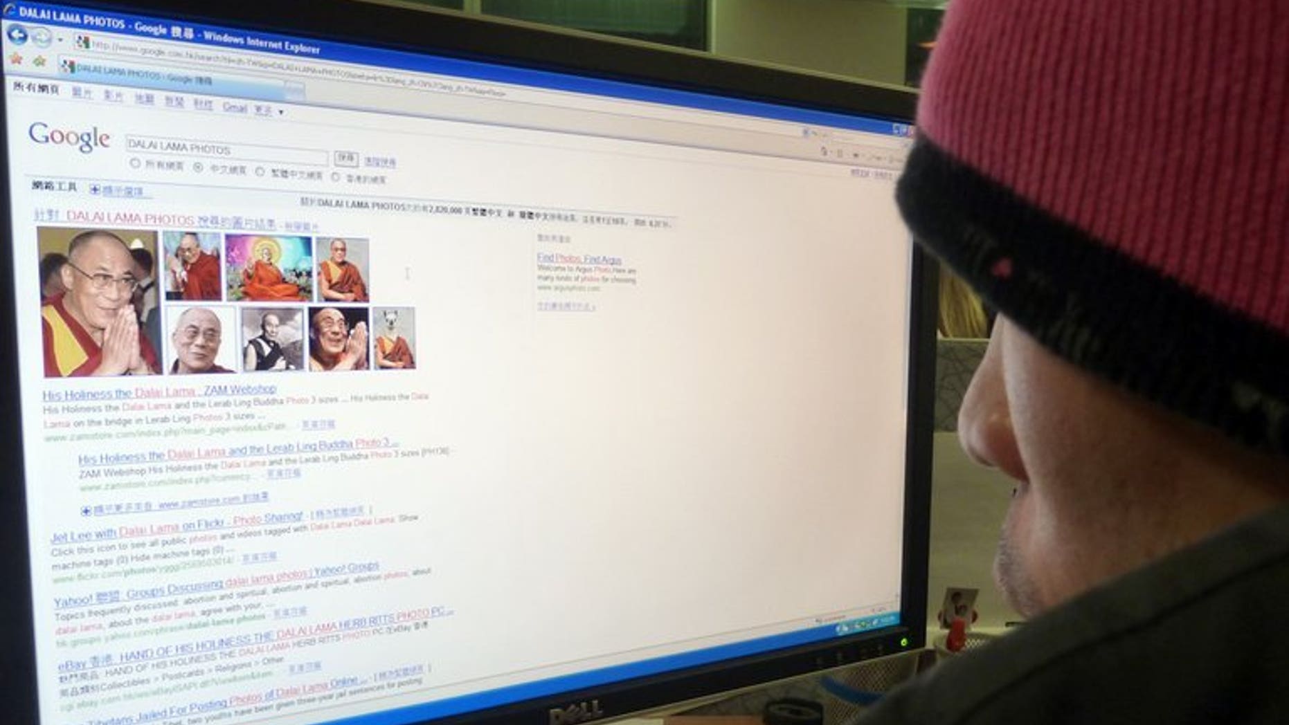 Illustration shows a Chinese man surfing the web for stories and photos of the Dalai Lama. Hackers have attacked the Tibetan government-in-exile's Chinese-language website with an unidentified virus, making the portal inaccessible, an official spokesman told AFP Tuesday.
