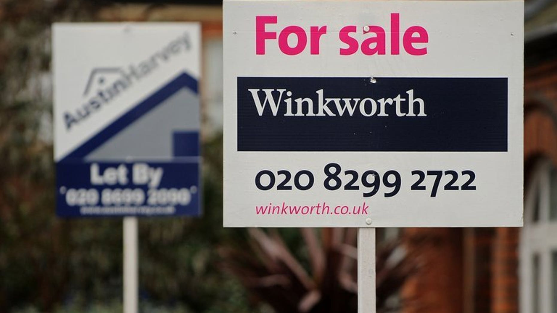 Estate agent's boards are displayed outside properties in London on December 30, 2010. Property prices across Britain are rising at their fastest pace since they hit a peak in 2006, a survey said on Tuesday.