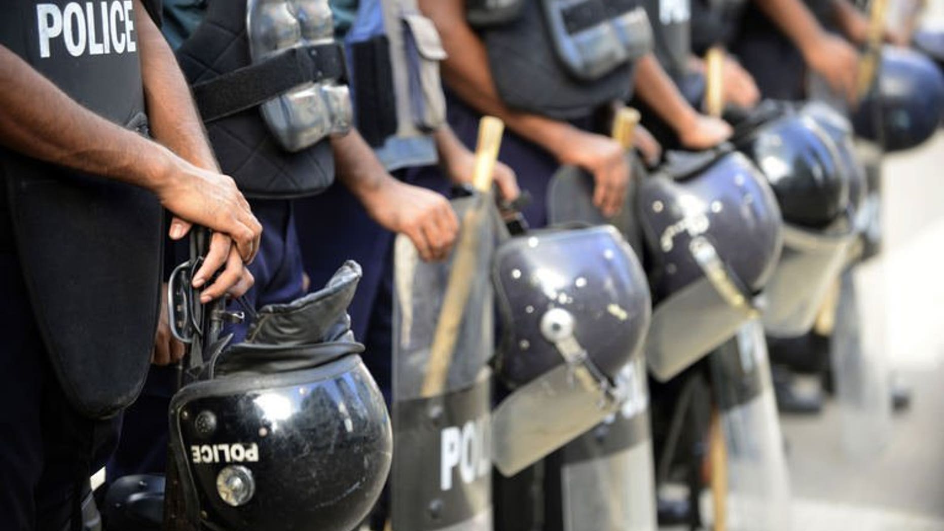 Bangladeshi police stand guard during a nationwide strike called by the Jumaat-e-Islami party in Dhaka, on August 13, 2013. Bangladesh police have fired rubber bullets and tear gas at supporters of the country's largest Islamist party as they protested against a ban preventing it from contesting next year's general elections.
