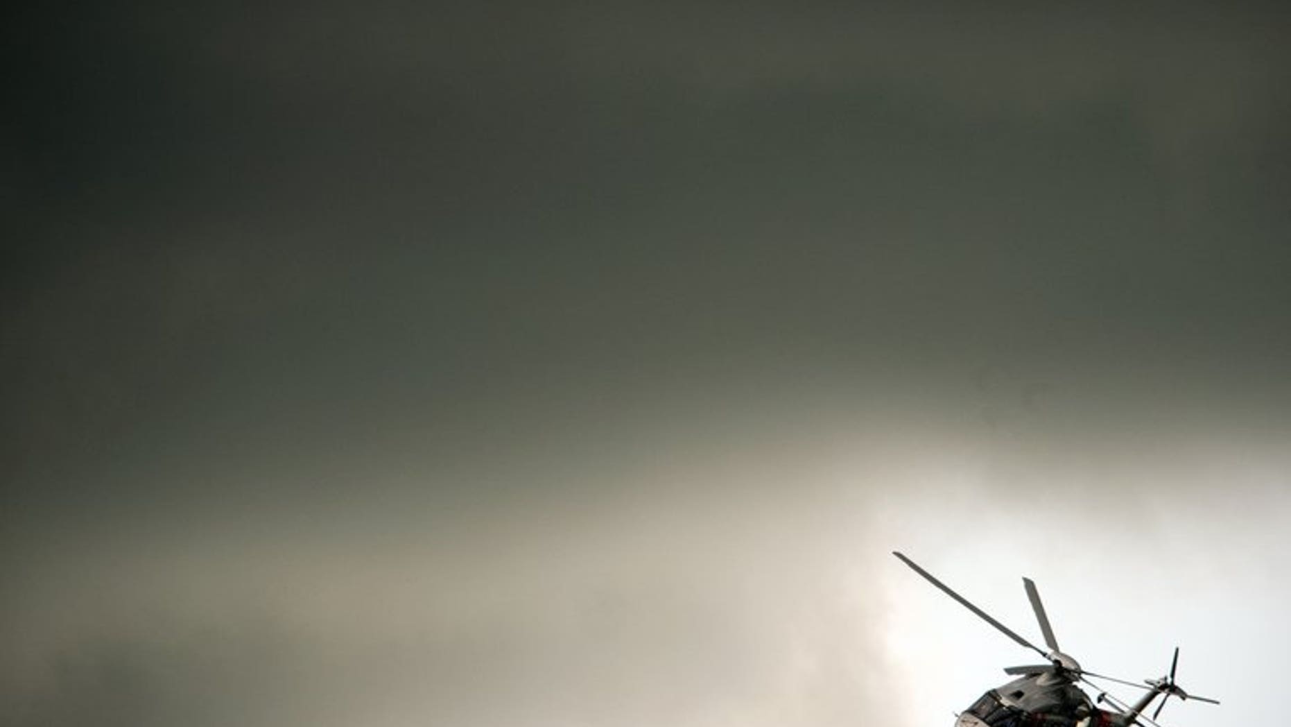 An AgustaWestland helicopter flies through the clouds at the Farnborough International Airshow in Hampshire, southern England, on July 11, 2012. Indian auditors accused the government Tuesday of breaking its own procurement rules to award a $748-million helicopter contract to Italian-owned AgustaWestland, which is under investigation for bribery, the Press Trust of India reported.
