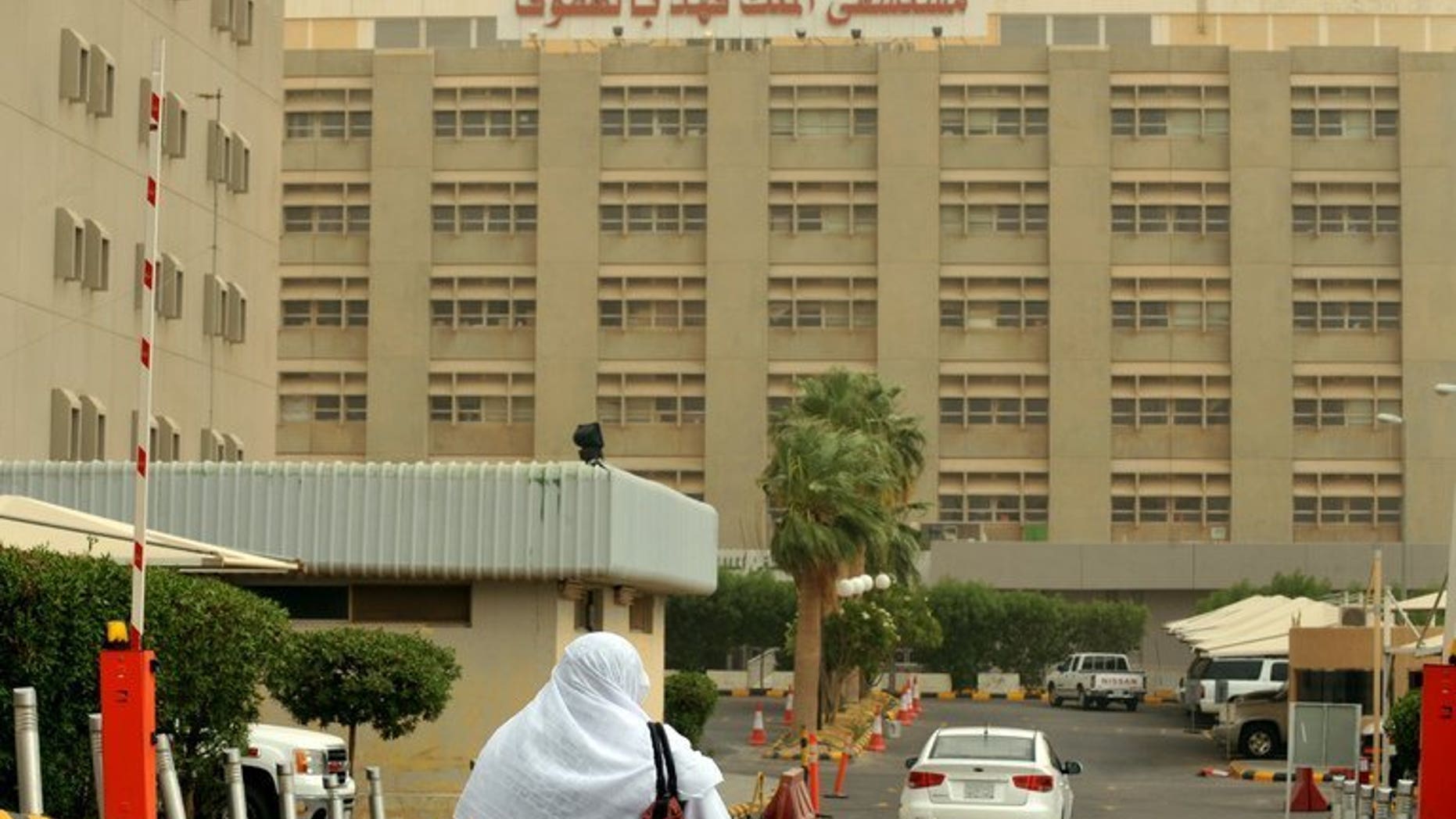 A Saudi nurse walks towards the King Fahad hospital in the city of Hofuf on June 16, 2013. A large influx of Muslim pilgrims on Saudi Arabia during the fasting month of Ramadan passed without any cases of the MERS coronavirus infection reported, authorities said.