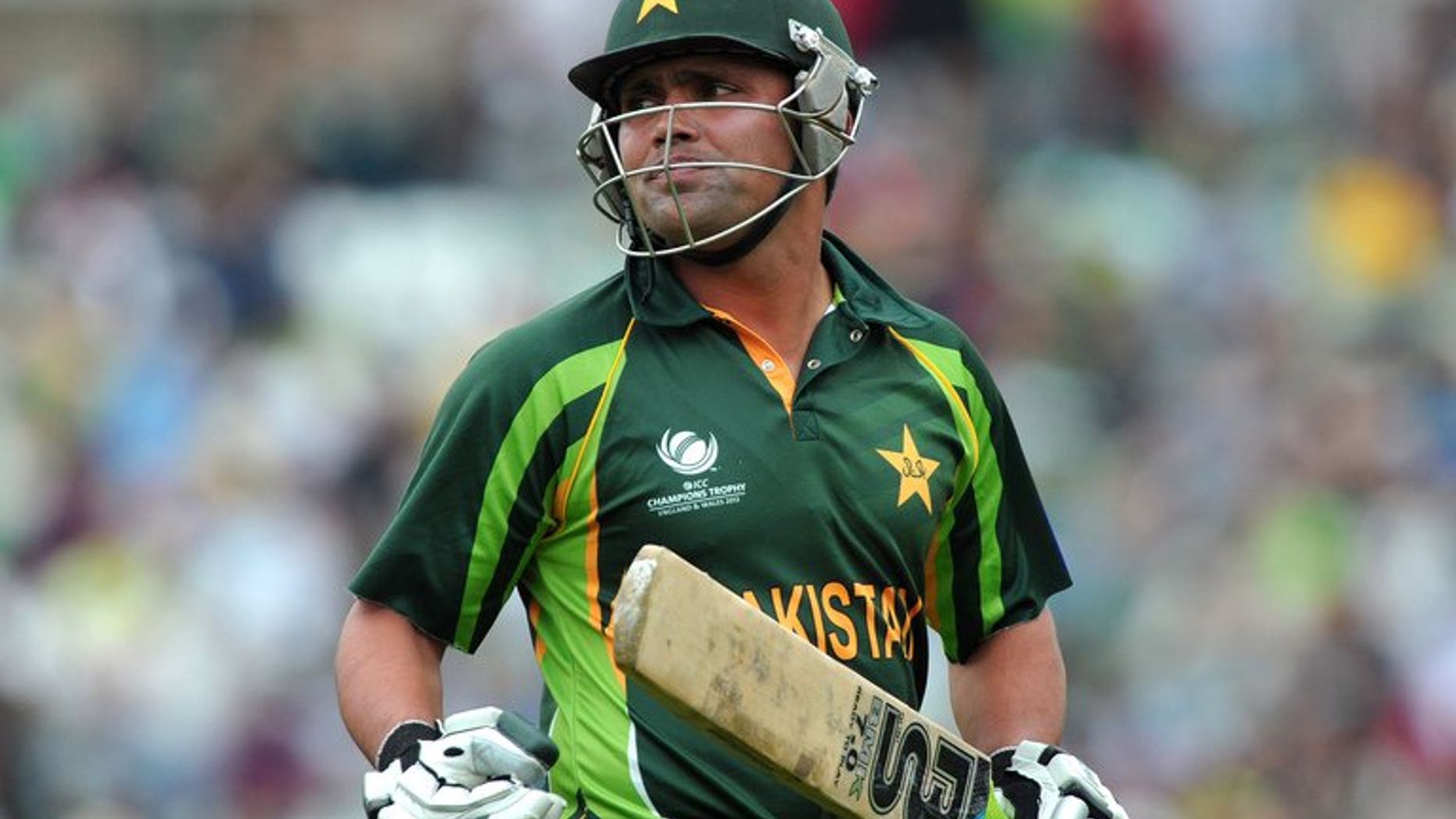 Pakistan's Imran Farhat leaves the pitch after being caught out during the 2013 ICC Champions Trophy cricket match between Pakistan and West Indies at The Oval in London on June 7, 2013. Farhat has pulled out of Pakistan's tour to Zimbabwe, citing personal reasons, and has been replaced by the uncapped Shan Masood, Pakistani cricket chiefs announced Tuesday.