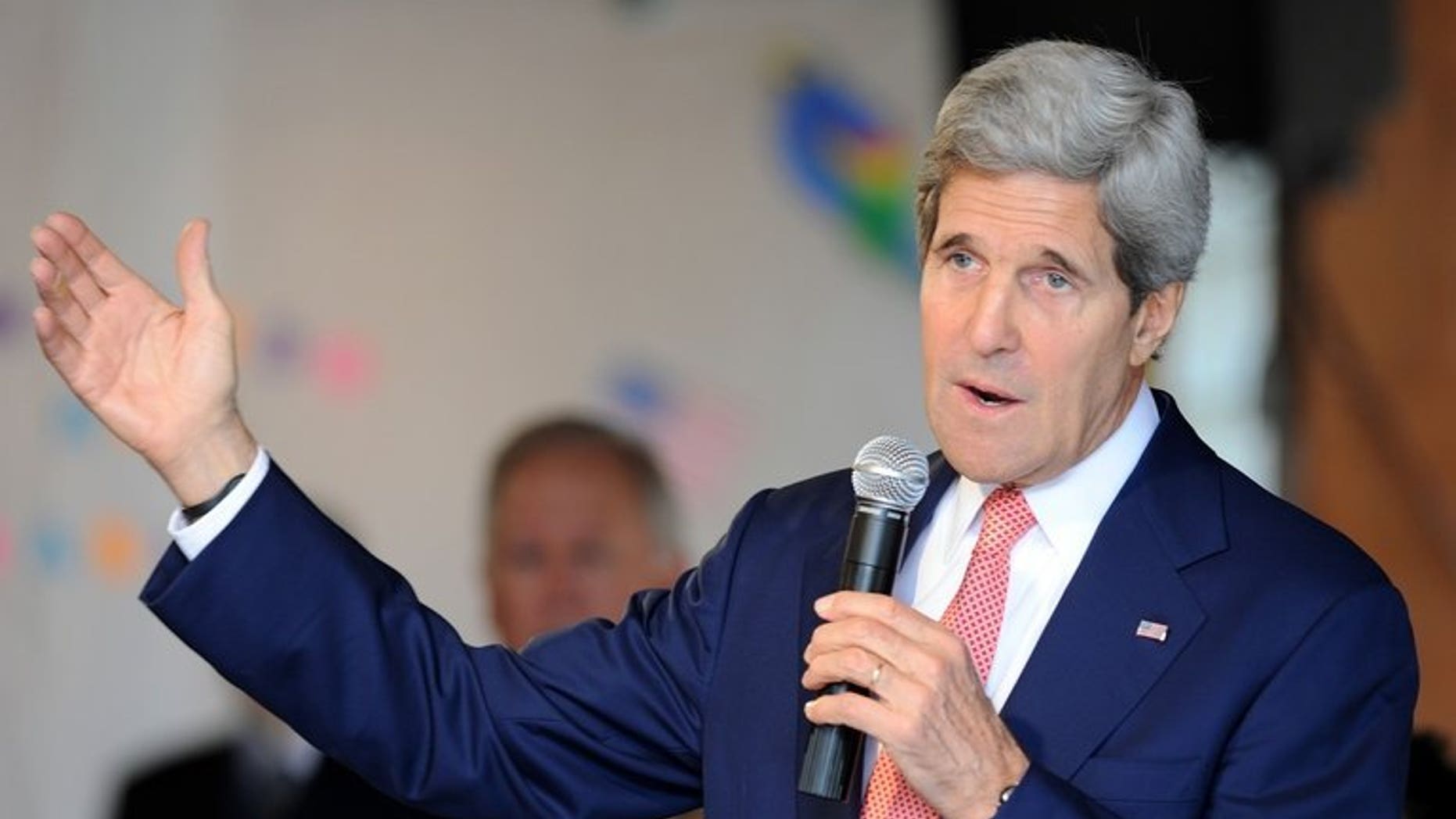 US Secretary of State John Kerry delivers a speech for US embassy employes and relatives in an event in Brasilia on August 13, 2013. Palestinian president Mahmud Abbas is committed to pursuing peace talks with Israel despite the unresolved issue of Israeli settlement building, Kerry said.