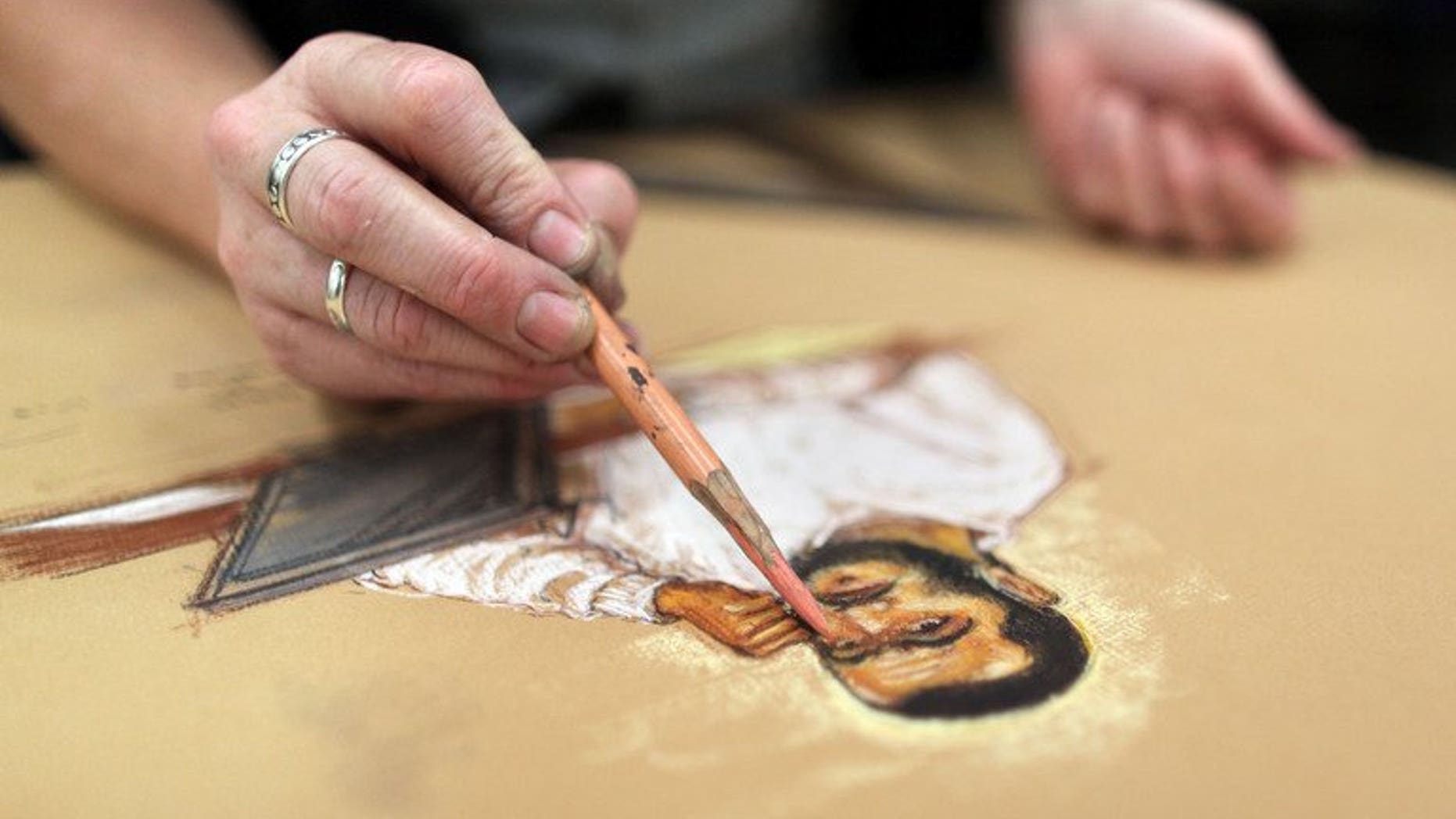 Courtroom artist Janet Hamlin finishes a sketch of Canadian defendant Omar Khadr, in Guantanamo Bay, Cuba, January 19, 2009. Khadr will apply to be transferred out of a Canadian maximum security prison to better accommodation, his lawyer said in comments reported Tuesday.
