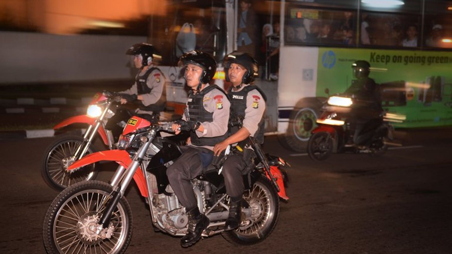 Police officers patrol on motorcycles around the capital city of Jakarta on August 5, 2013. Indonesia's anti-corruption agency has arrested the head of the country's upstream oil and gas regulator over allegations of bribery, an official said Wednesday.