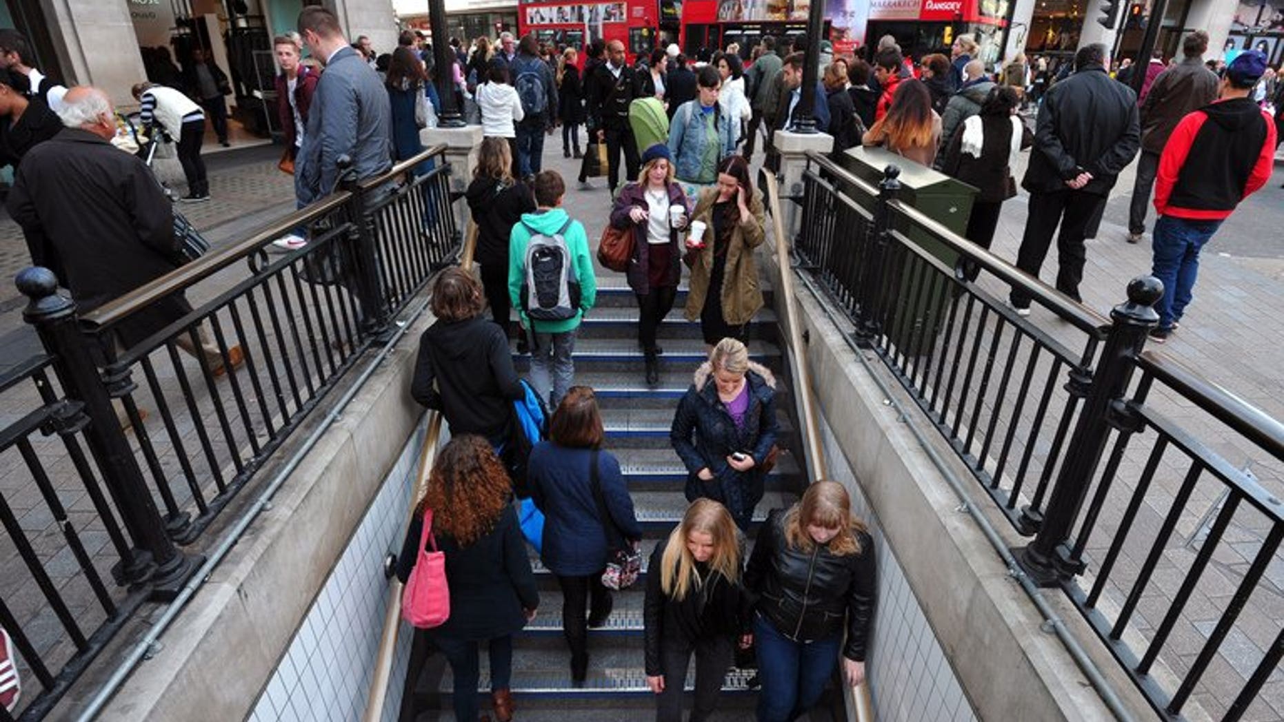 People enter an underground station in central London on October 17, 2012. Britain's unemployment rate remains at 7.8 percent, significantly above a level that could trigger the Bank of England to raise its main interest rate, official data showed on Wednesday.