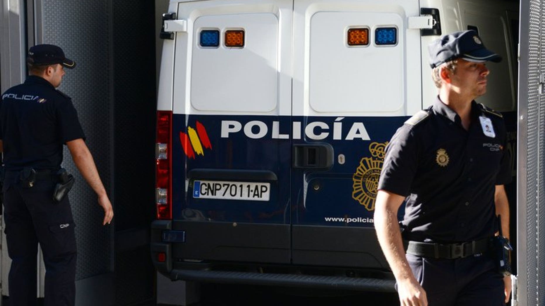 A Spanish police van carrying convicted child rapist Spaniard Daniel Galvan arrives at a courthouse in Madrid on August 6, 2013. Galvin jailed in Spain after he was controversially freed by the King of Morocco will appear before a judge in late August on historic abuse charges.
