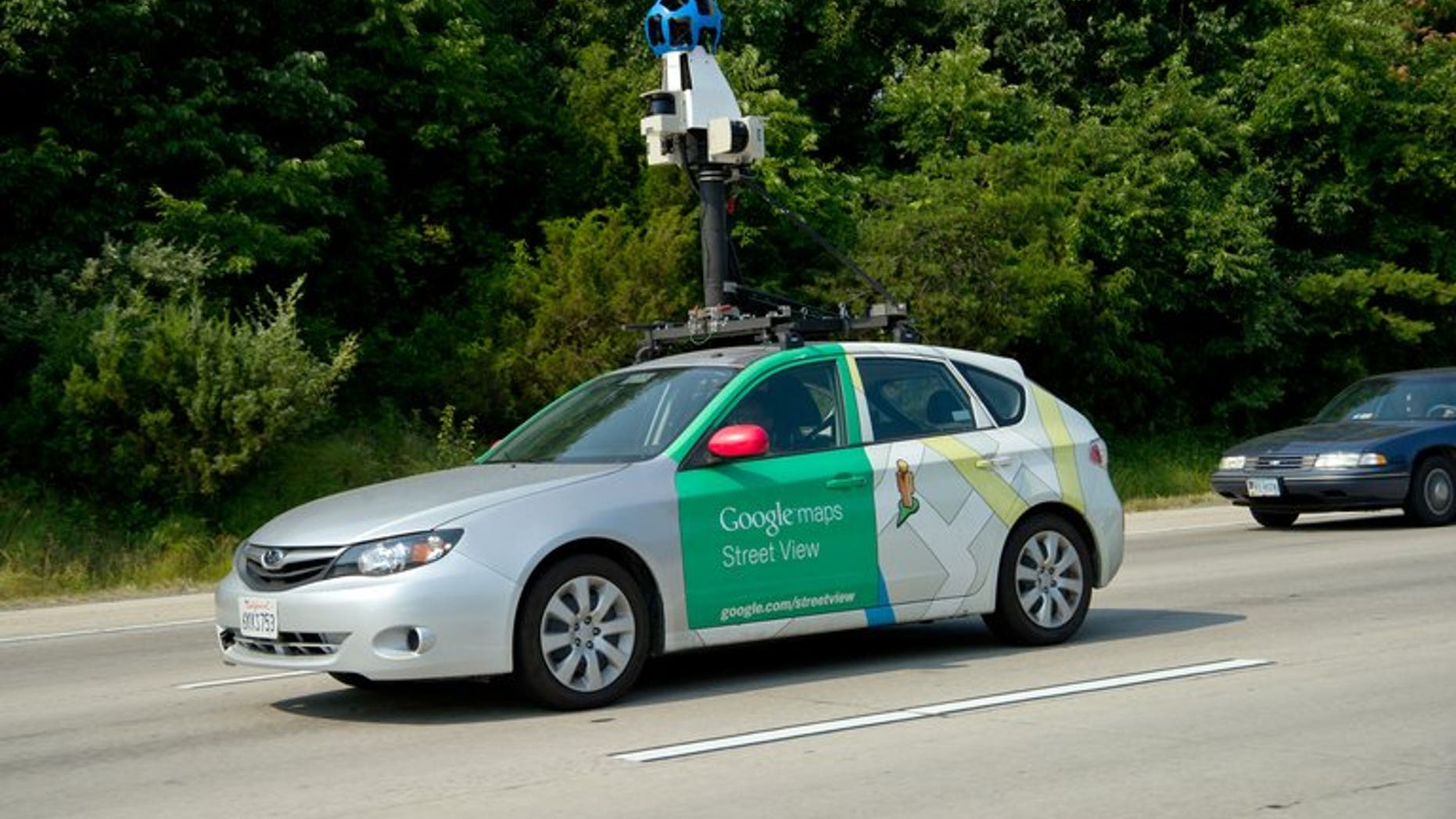 This June 28, 2012 photo shows a Google Street View vehicle as it collects imagery while driving down Interstate I-66 near Centreville, Virginia. Thai villagers on Wednesday apologised for mistaking a Google worker for a government snoop as he carried out mapping for the Internet giant's "Street View" programme in a remote area.
