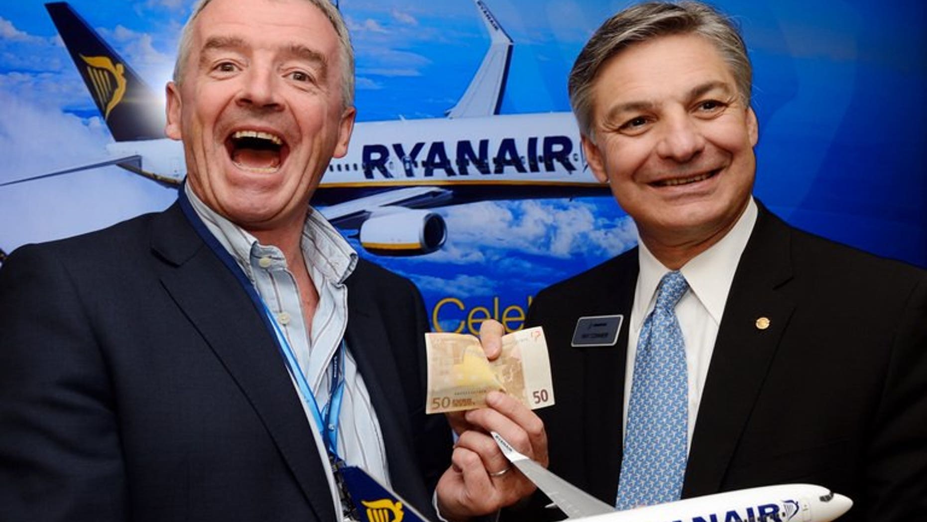 Ryanair chief executive officer Michael O'Leahry (left) and Boeing Airplane President Ray Conner on June 19, 2013 at Le Bourget airport, Paris. Ryanair has fired a pilot who contributed to a British television documentary that raised fears over its fuel policy, the Irish no-frills airline has announced.