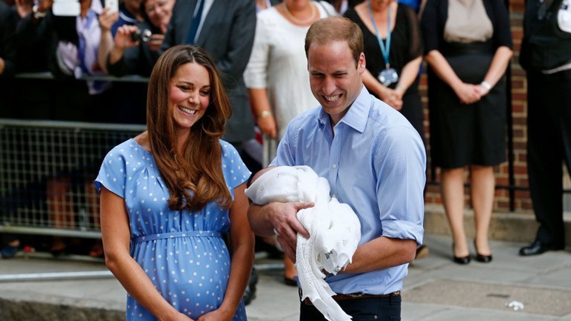 Prince William and Catherine with Prince George outside St Mary's Hospital in London on July 23. Kate will next month attend her first public engagement since giving birth, when she takes part in a charity event with her husband, the palace said on Thursday.