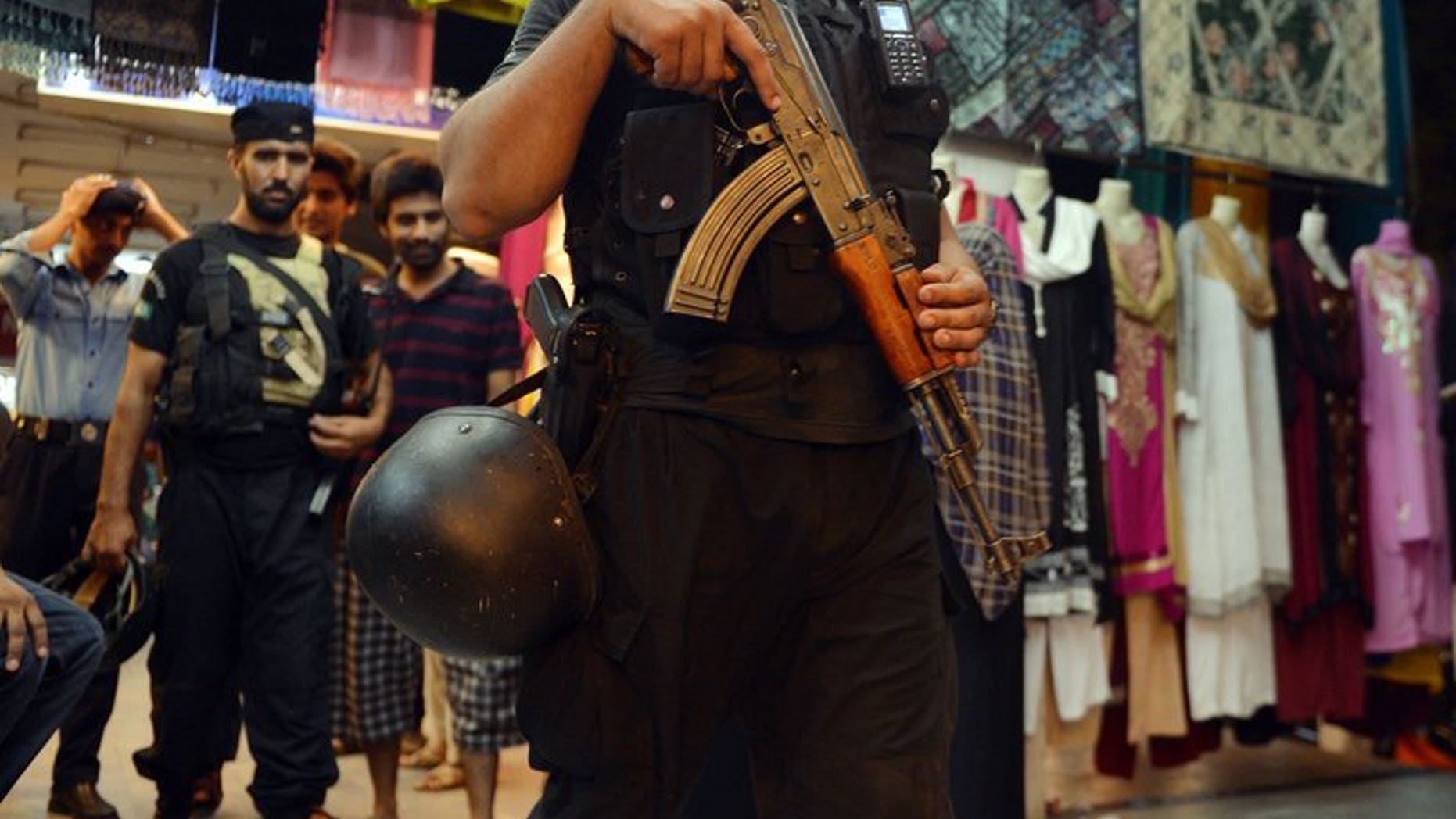 A Pakistani police commando patrols in Islamabad on August 7, 2013. Police in Islamabad are locked in a stand-off with a man armed with two automatic guns who was randomly firing in the air in the Pakistani capital Thursday.