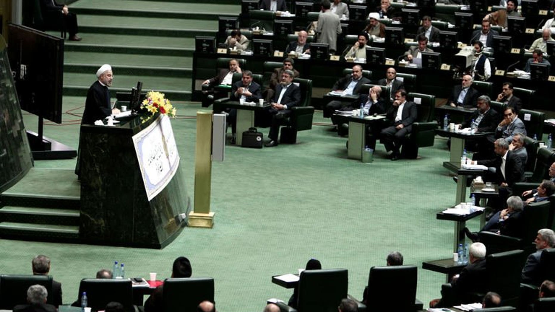 Iranian President Hassan Rowhani speaks during a parliament session to elect the cabinet members on August 15, 2013 in Tehran. Iran MPs approved 15 of Rowhani's 18 cabinet picks.