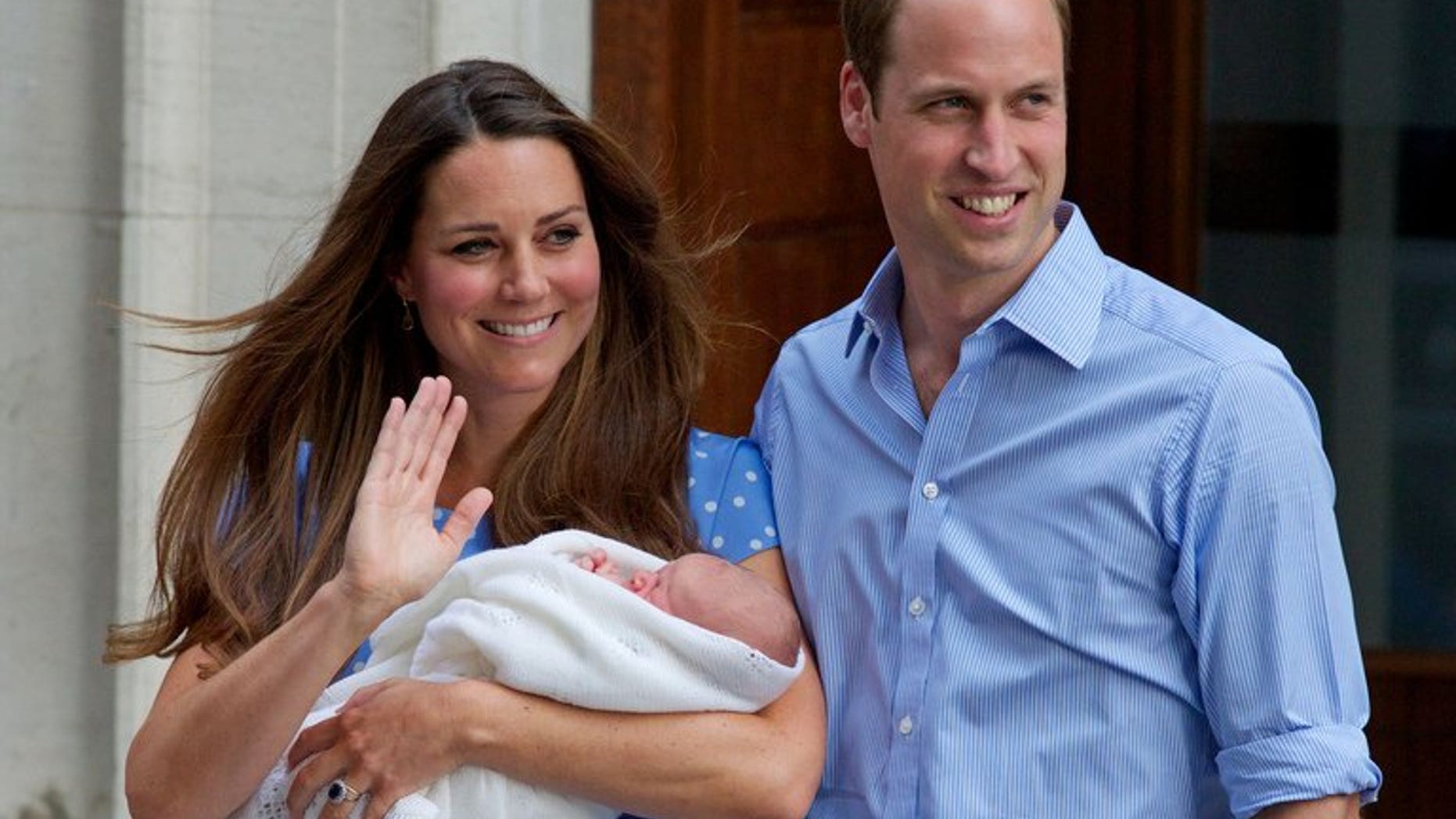 Prince William and Catherine, Duchess of Cambridge show their new-born baby boy on July 23, 2013 in London. Britain's royal baby, Prince George, was on Thursday made a member of Bosnia's top football club FK Zeljeznicar in a gesture of gratitude for the humanitarian work of his late grandmother Princess Diana.