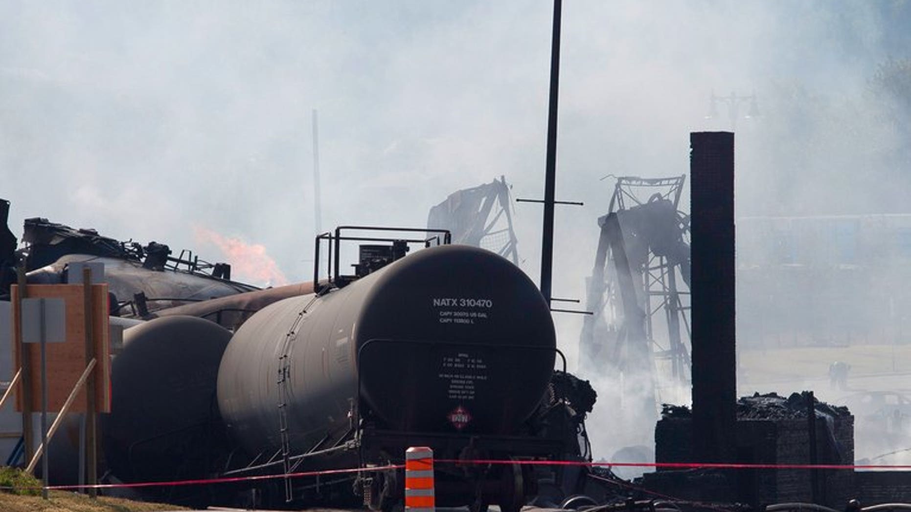 Wreckage burns on July 7, 2013 after a freight train loaded with oil derailed July 6 in Lac-Megantic in Canada's Quebec province. Canadian Pacific Railway will appeal a government order to pay for the clean-up of a deadly train derailment in Canada's Quebec province in July, a spokesman said Thursday.