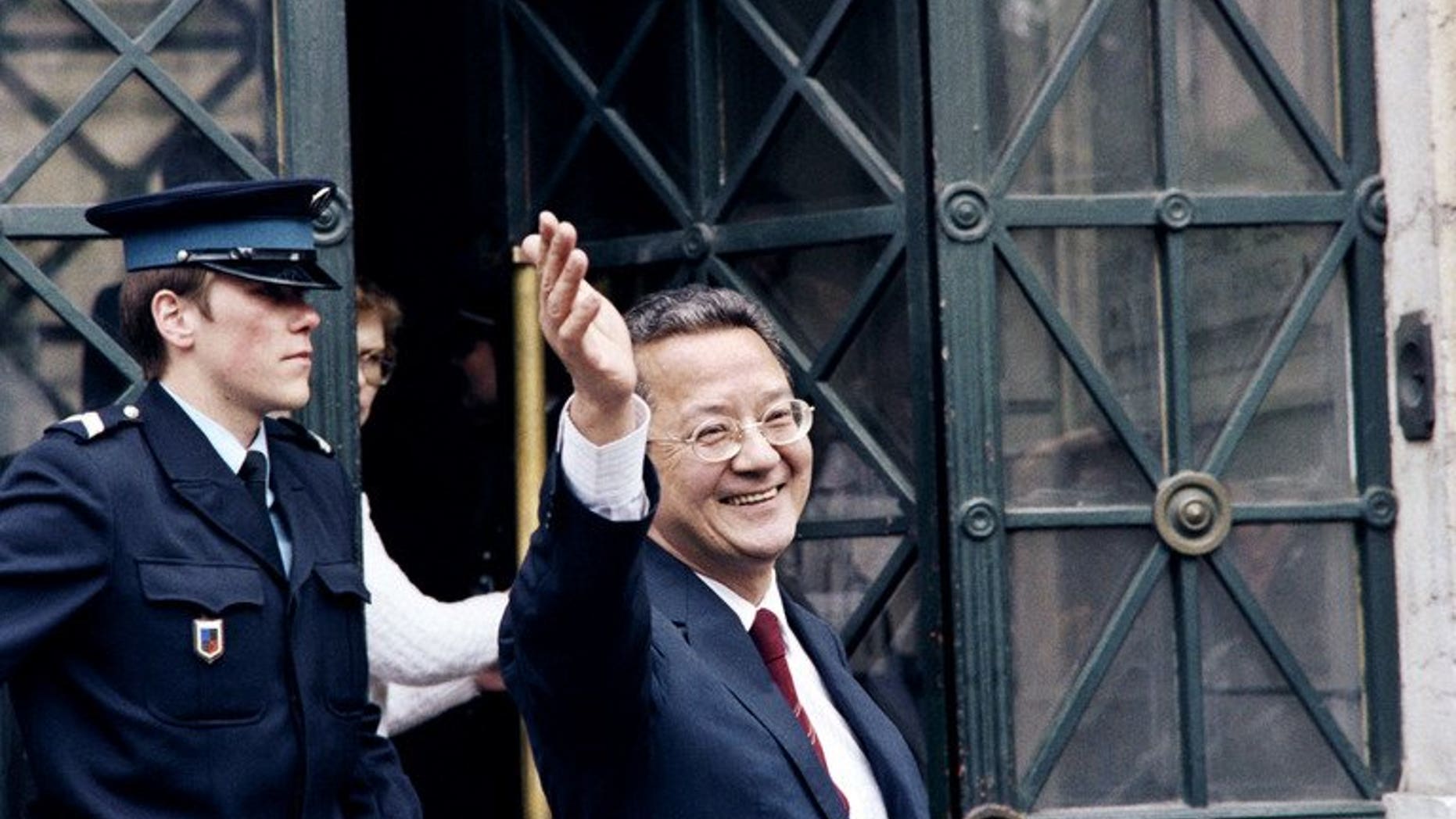 A file picture taken on May 14, 1987 shows French lawyer Jacques Verges waving in front of the law court of Lyon. Verges, who died on August 15, 2013 at the age of 88, was one of the most controversial and feared lawyers recognised by the Paris bar.
