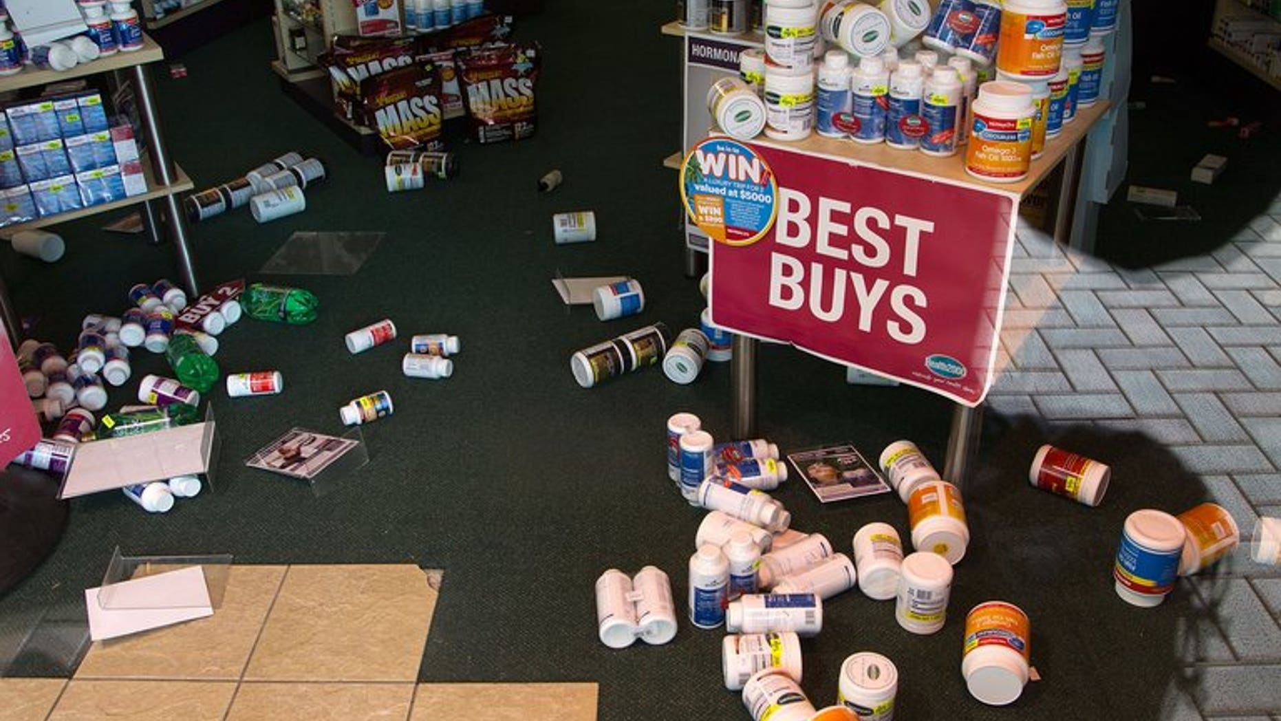 Stock lays on the floor inside a retail store in Wellington on July 22, 2013, following an earthquake a day earlier. There have been hundreds of aftershocks since the July quake.