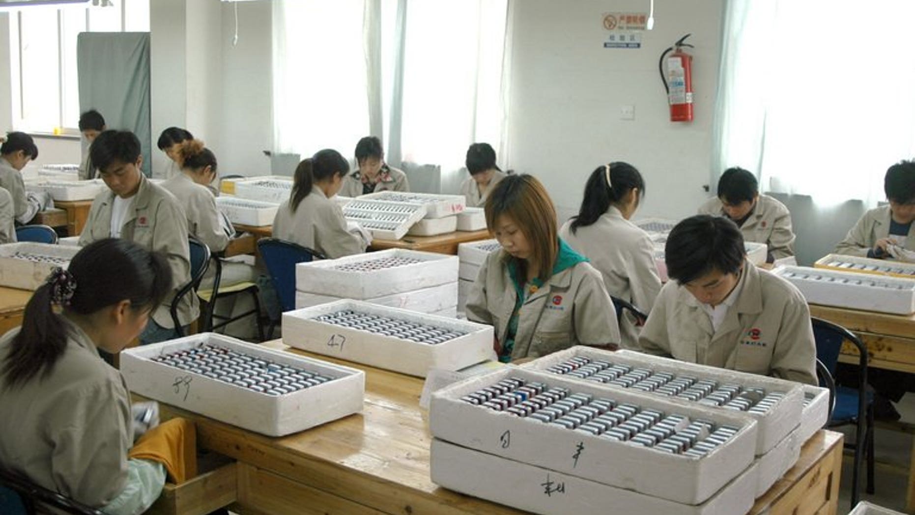 Workers assemble lighters at the Rifeng factory in Wenzhou, China's Zhejiang province in 2006. A former vice mayor of China's eastern city of Wenzhou was Friday sentenced to three years in jail for abuse of power in a land deal, state media reported.