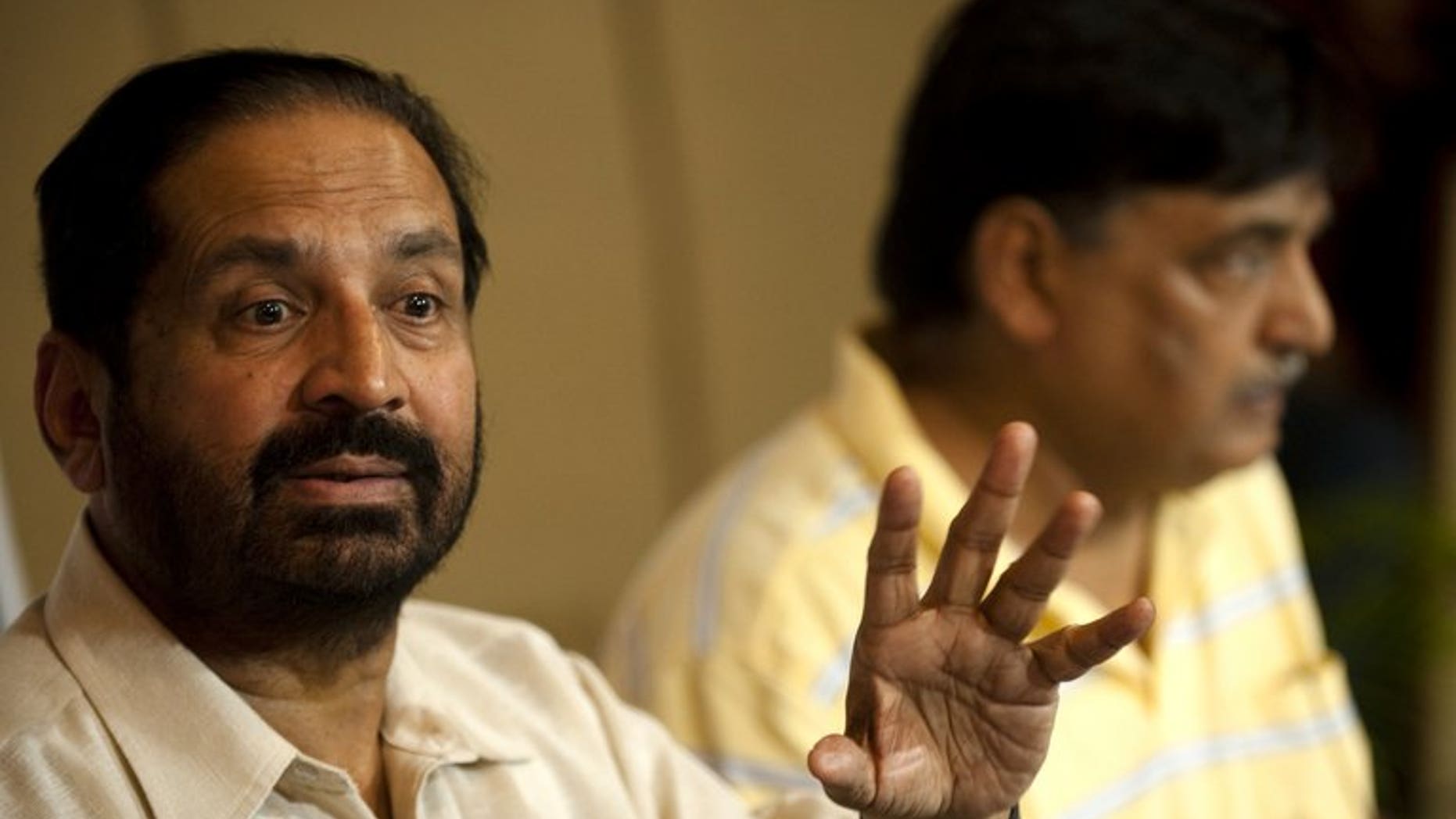 Former Indian Olympic Association (IOA) chief Suresh Kalmadi (left) and Lalit Bhanot give a press conference in New Delhi, on September 2, 2010. The IOC has sent a 43-page draft constitution that needs to be adopted by the suspended Indian Olympic Association (IOA) before its next elections in September, an Indian Olympics official has told AFP.