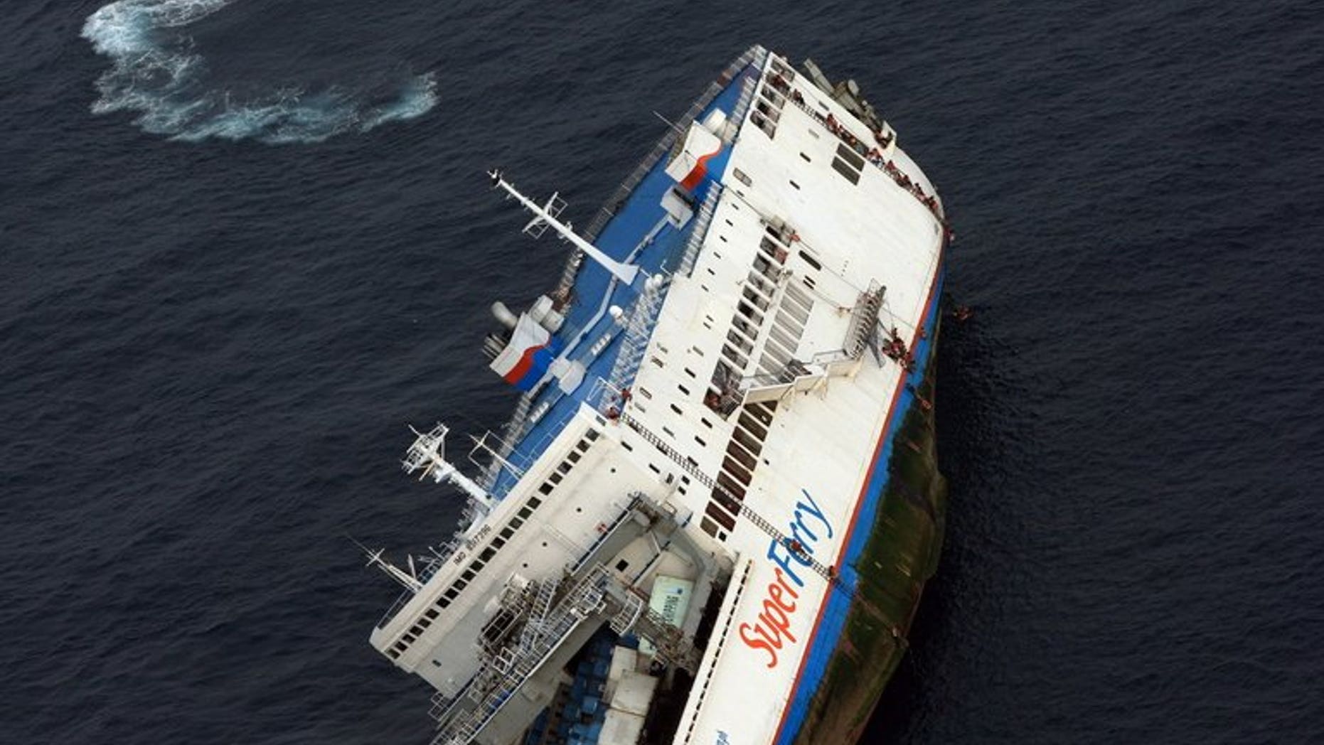 File picture of Superferry 9 listing off Zamboanga peninsular in September 2009. The Philippines coastguard launched a rescue mission Friday night after a ferry carrying almost 700 people collided with a cargo ship off the central city of Cebu, officials said.