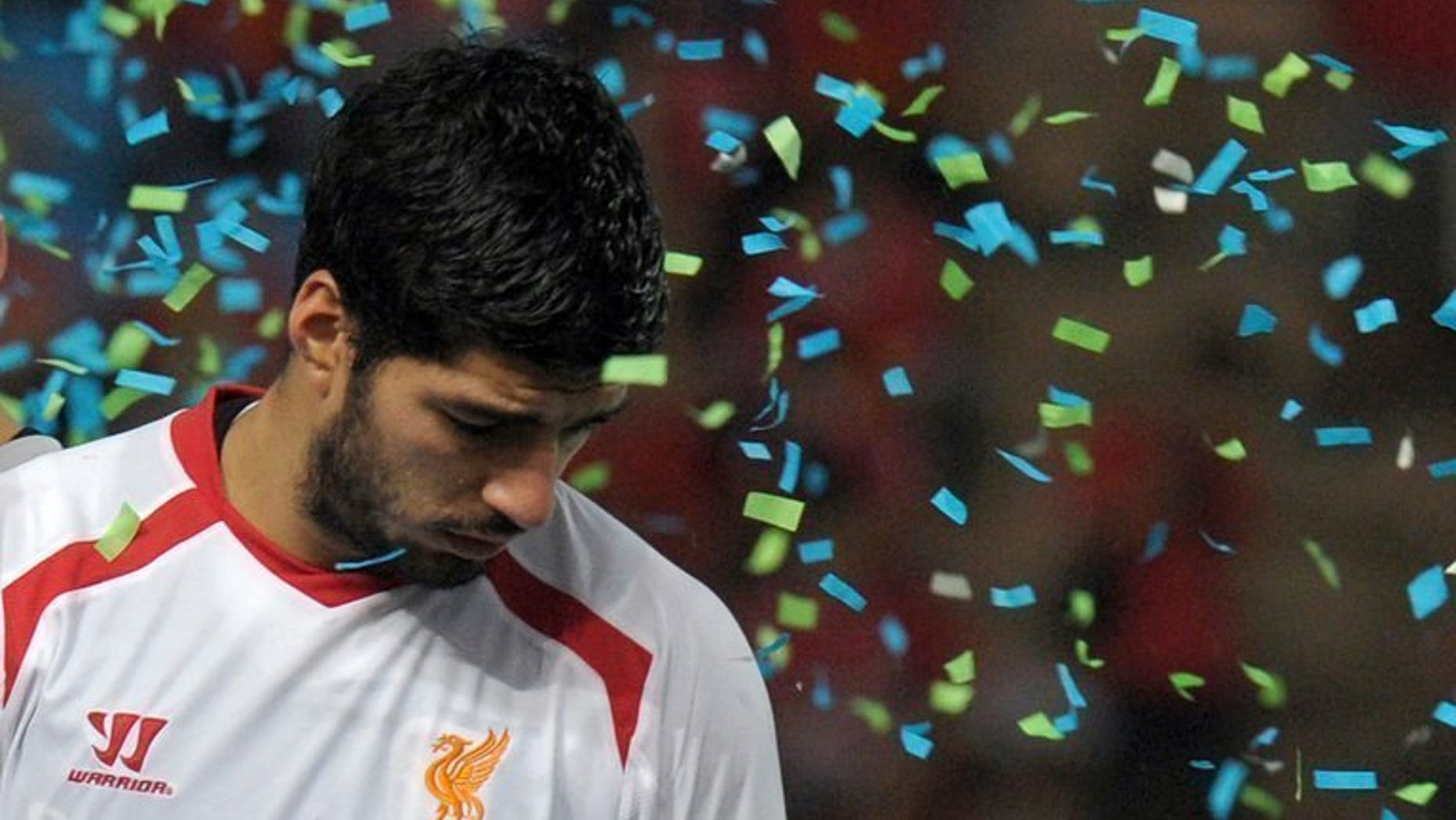 Liverpool's Luis Suarez reacts after the match against Thailand at the Rajamangala National Stadium in Bangkok, on July 28, 2013. Suarez has returned to first-team training, according to British media reports.