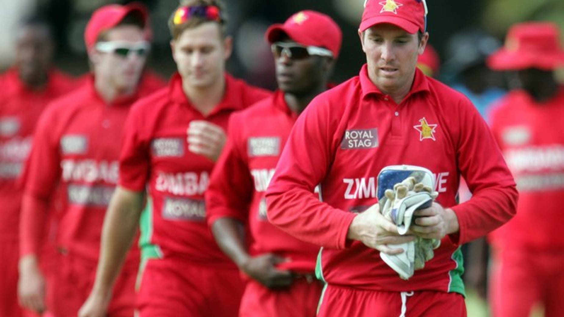 Zimbabwe's captain Brendan Taylor leaves the field with teammates at Queens Sports Club on August 3, 2013 in Harare. Zimbabwe's cricketers have returned to training after a brief stand-off with Zimbabwe Cricket over unpaid wages and the value of future contracts, ensuring that Pakistan's tour of the country will go ahead as planned.