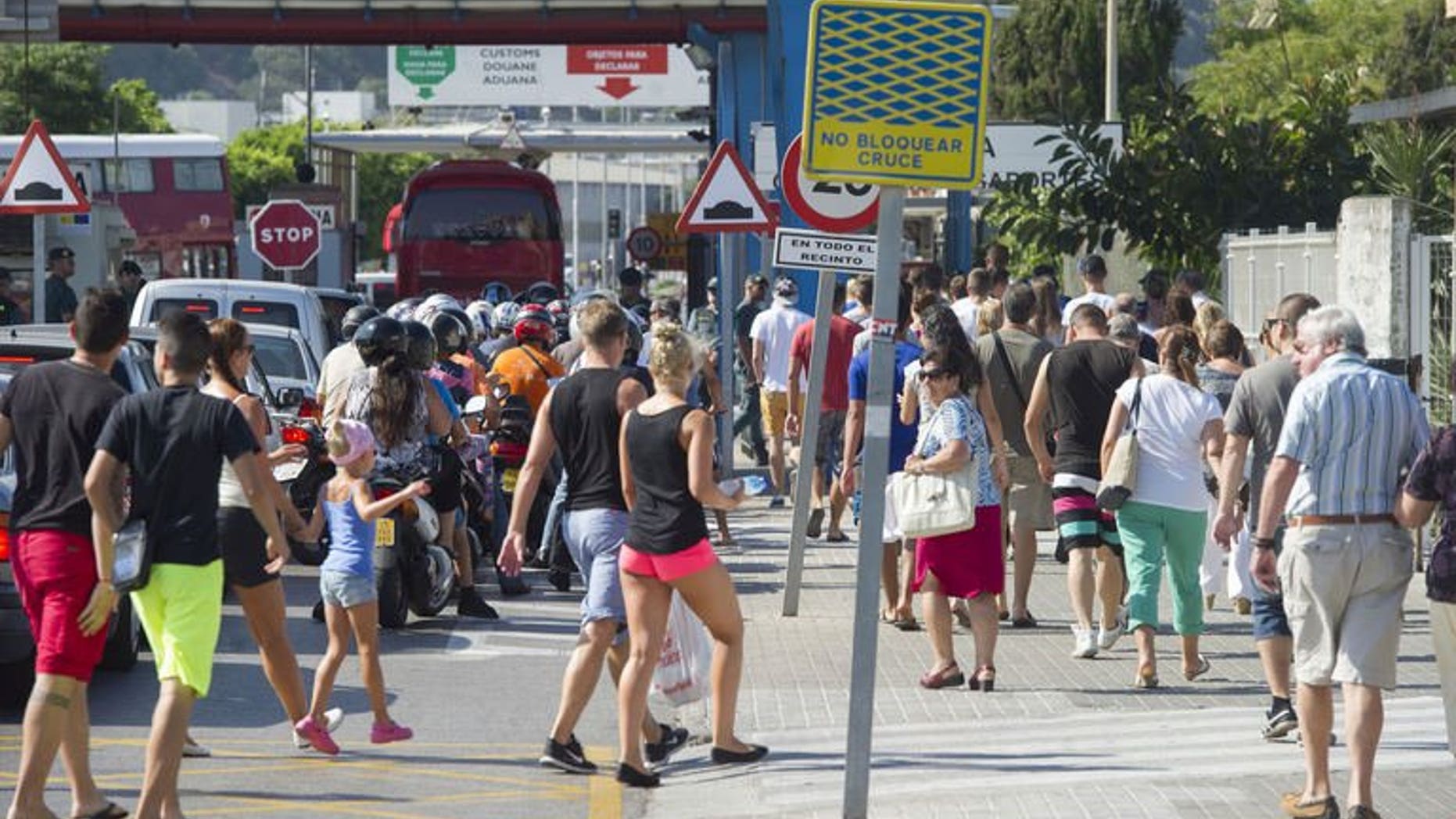 Motorists queue to cross the border between Spain and Gibraltar in La Linea de la Concepcion on August 15, 2013. British Prime Minister David Cameron has called on European Commission president Jose Manuel Barroso to send monitors to observe "politically motivated" checks at Spain's border with Gibraltar as soon as possible, Downing Street said Friday.