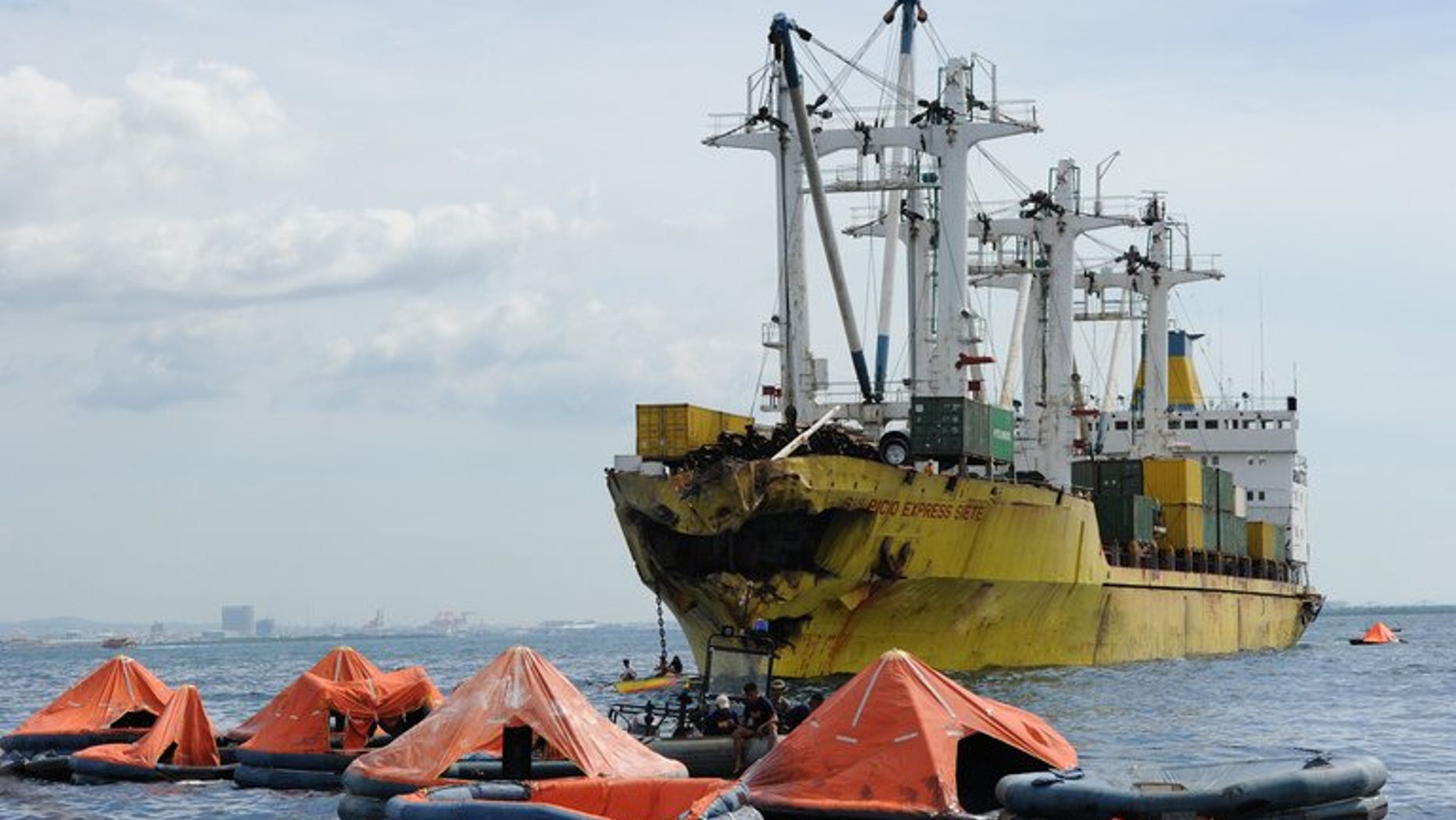 Life rafts from the sunken ferry St. Thomas Aquinas float in front of a cargo ship on August 17, 2013 after a colliding with the ferry the night before off the town of Talisay. A company whose cargo ship was involved in the Philippines' latest ferry disaster confirmed Saturday its vessels were involved in four other tragedies that claimed more than 5,000 lives between them.