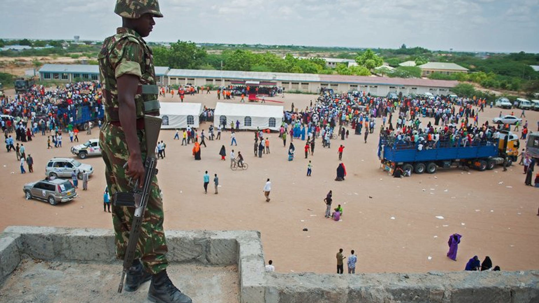 A Kenyan soldiers watches a political rally in Garissa on February 27. An attack blamed on Somali Islamist insurgents left four people dead in eastern Kenya and prompted hundreds to flee into the bush, authorities and the Red Cross said Saturday.