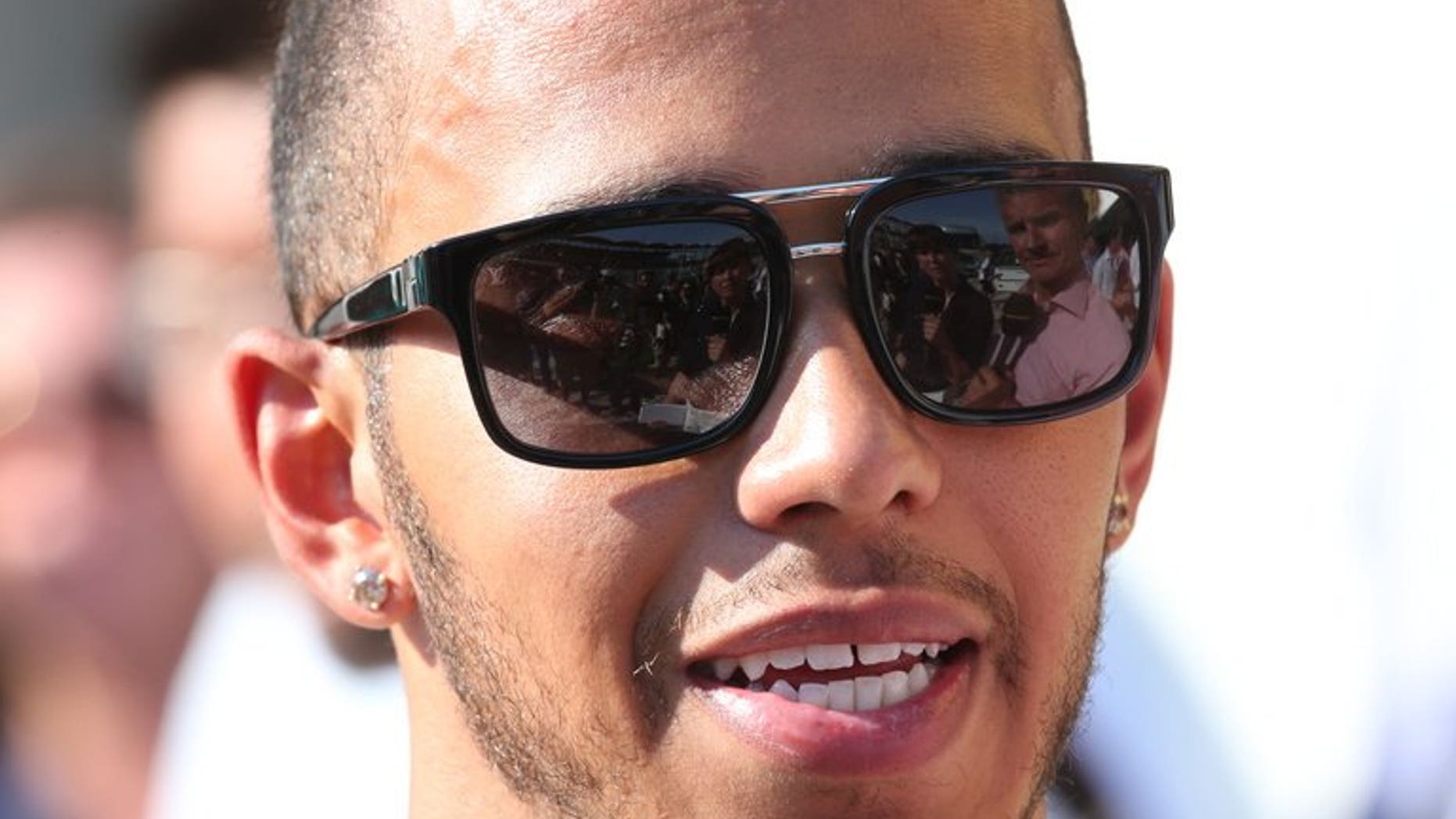 Lewis Hamilton speaks to the press at the Hungaroring circuit in Budapest on July 28. Mercedes team chief Ross Brawn believes that Hungarian Grand Prix winner Hamilton still has much more to offer to the team despite his recent surge of excellent form.